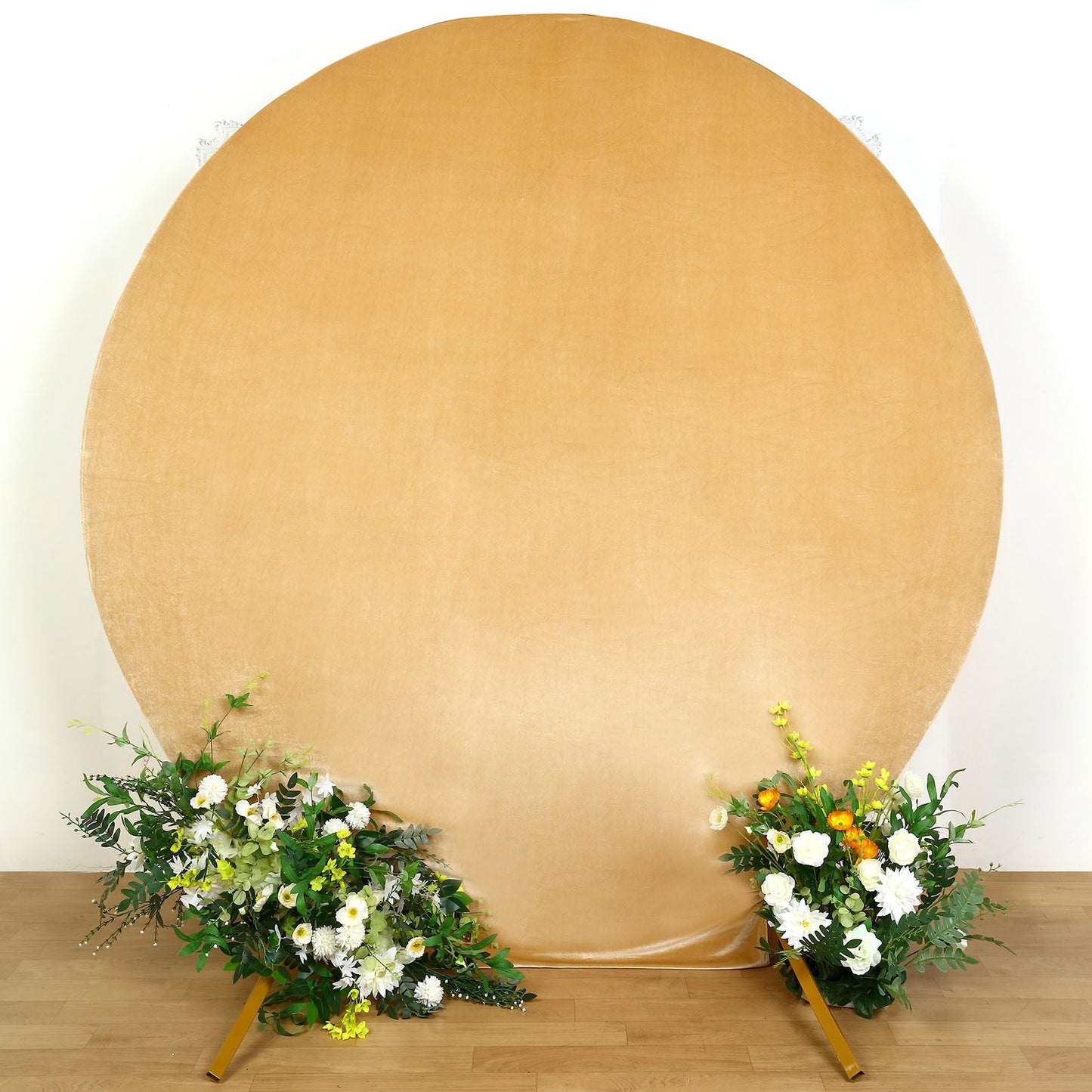 Champagne soft velvet fitted round wedding arch cover with floral arrangements.