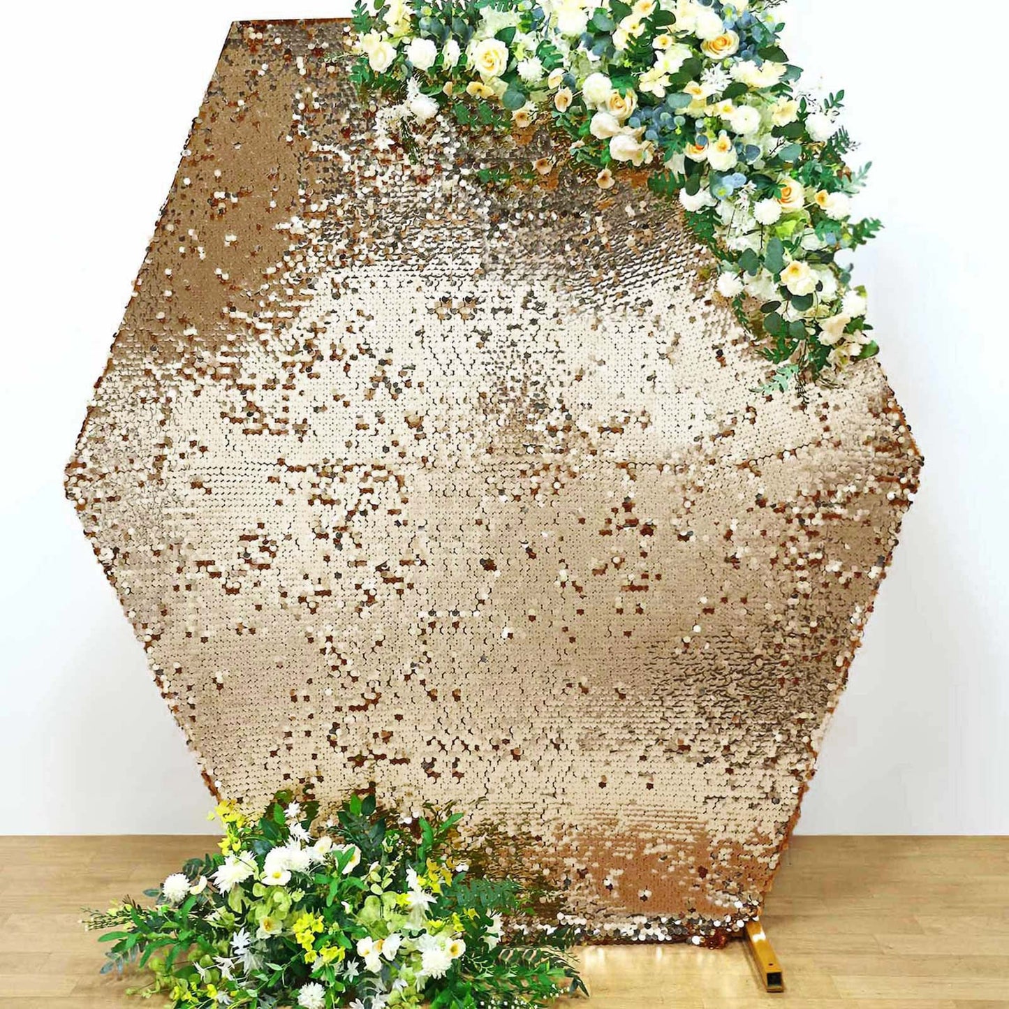 Gold sequin hexagon wedding arch cover with floral accents.