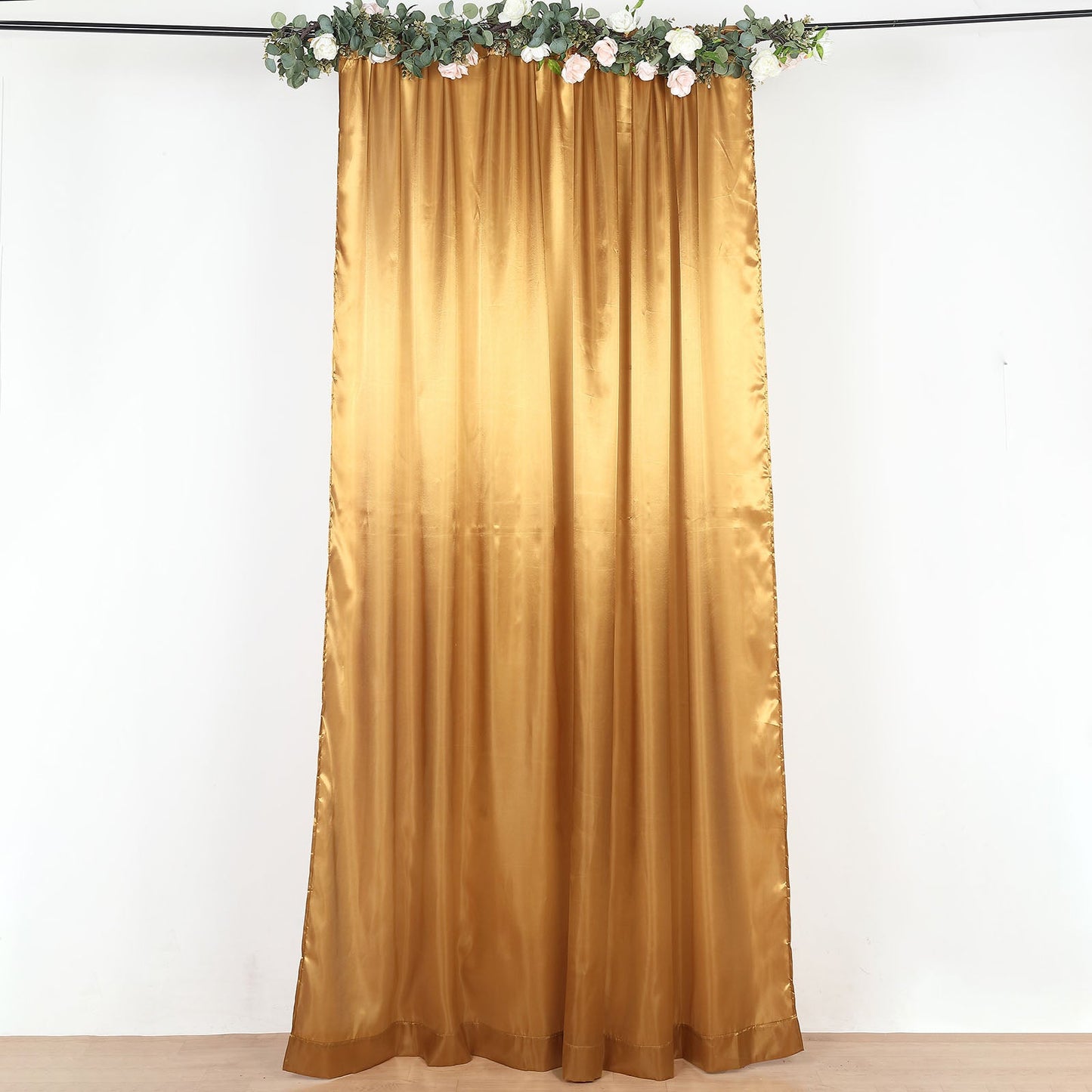 Gold satin event curtain drapes, perfect for backdrops and special occasions.