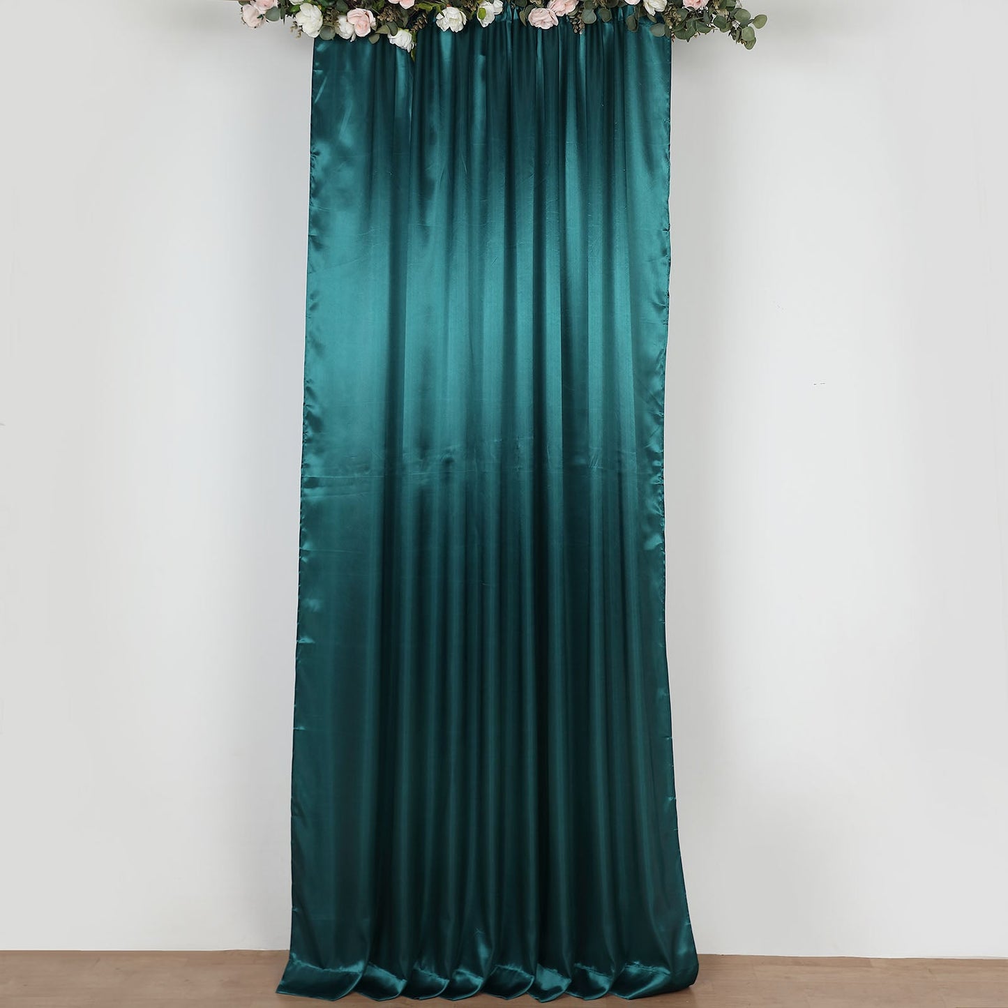 Peacock teal satin event curtain drapes, perfect for backdrops and decor.