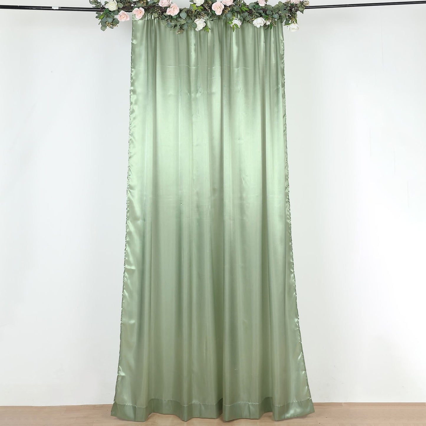 Sage green satin event curtain drapes backdrop panel.