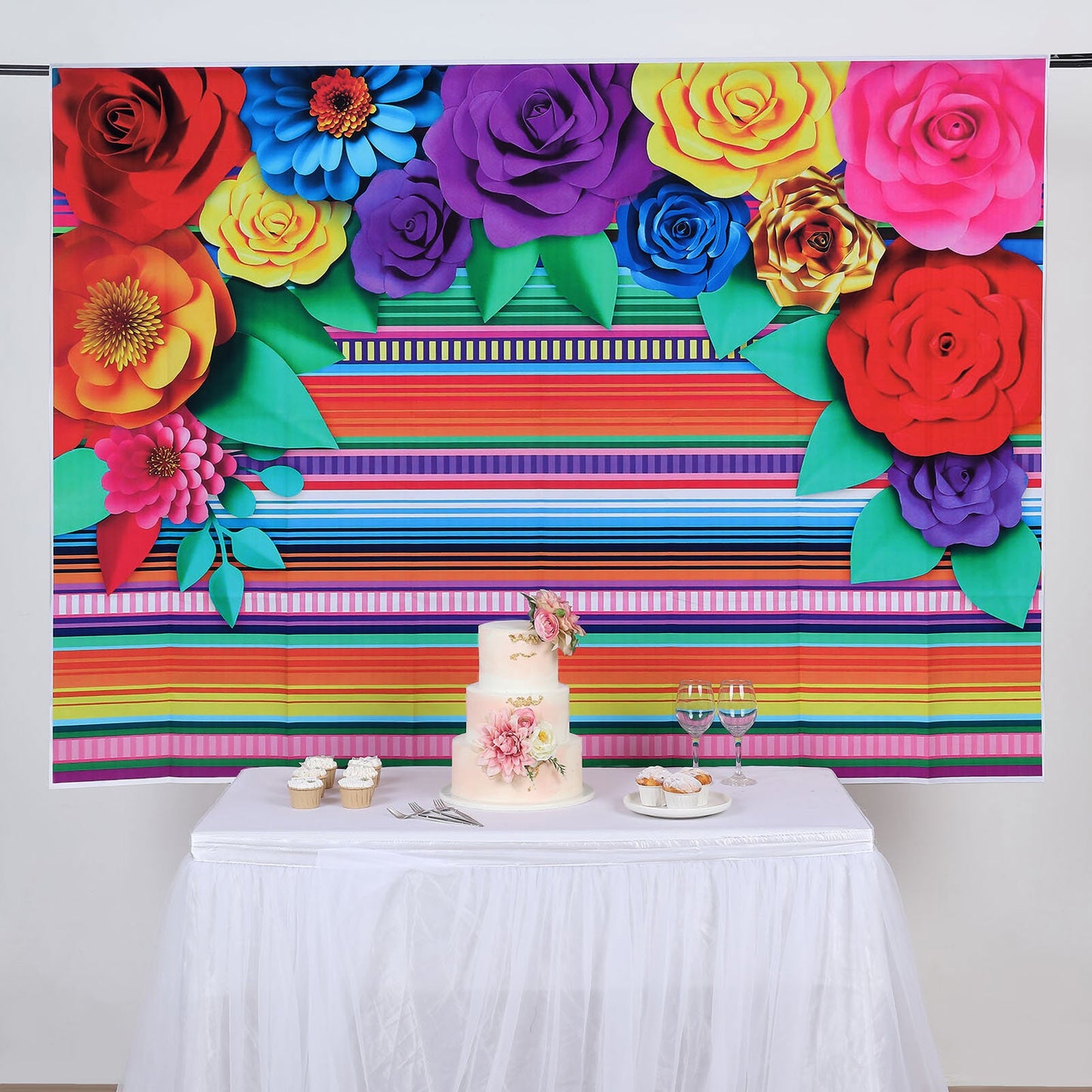 Colorful Cinco De Mayo fiesta backdrop with vibrant flowers and striped design.