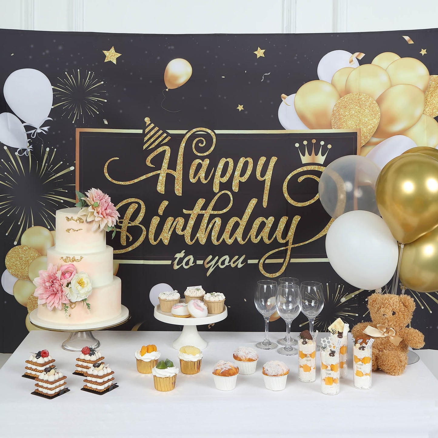 Black and gold happy birthday backdrop for photo booth decoration.