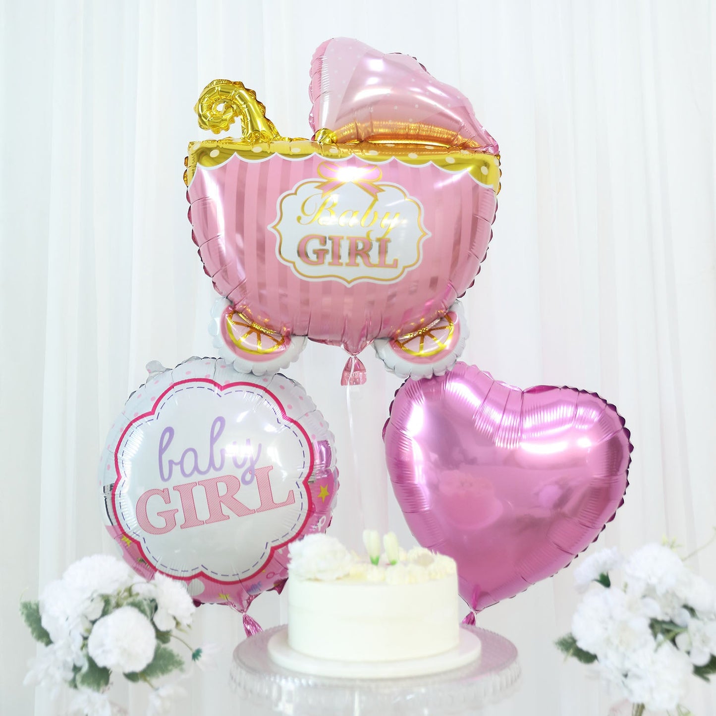 Set of 5 pink baby shower mylar foil balloons with heart and carriage designs.