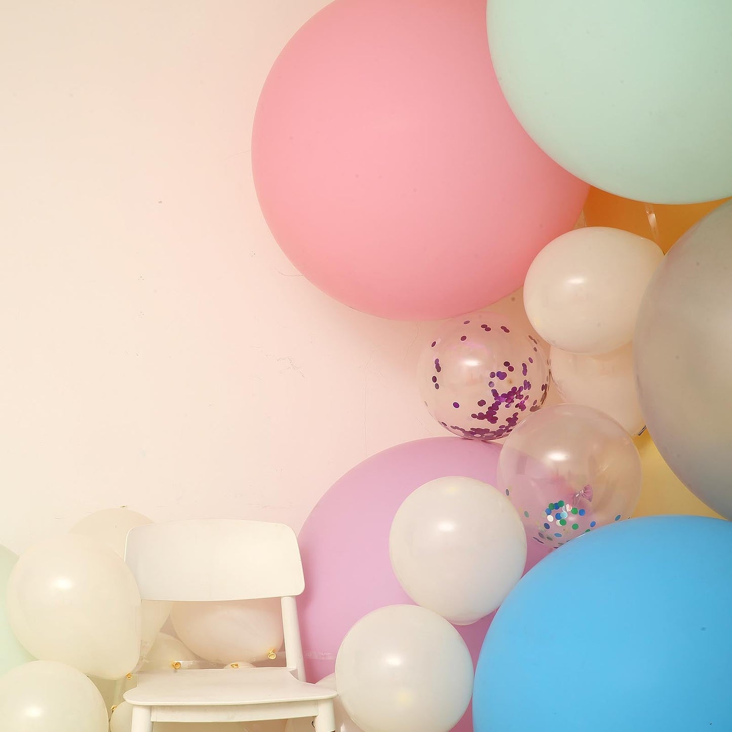 Large matte pastel seafoam latex balloons in a colorful arrangement.