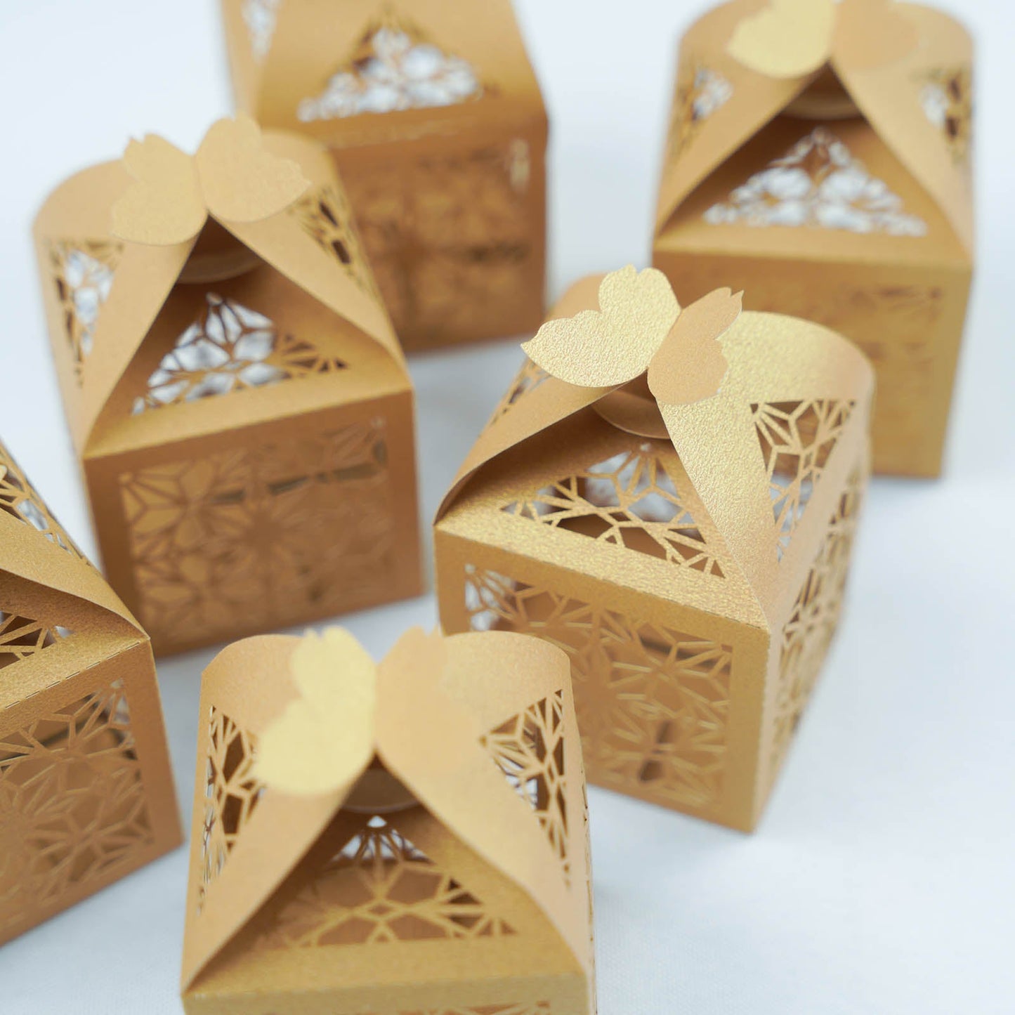 Gold butterfly top laser cut lace favor candy gift boxes.