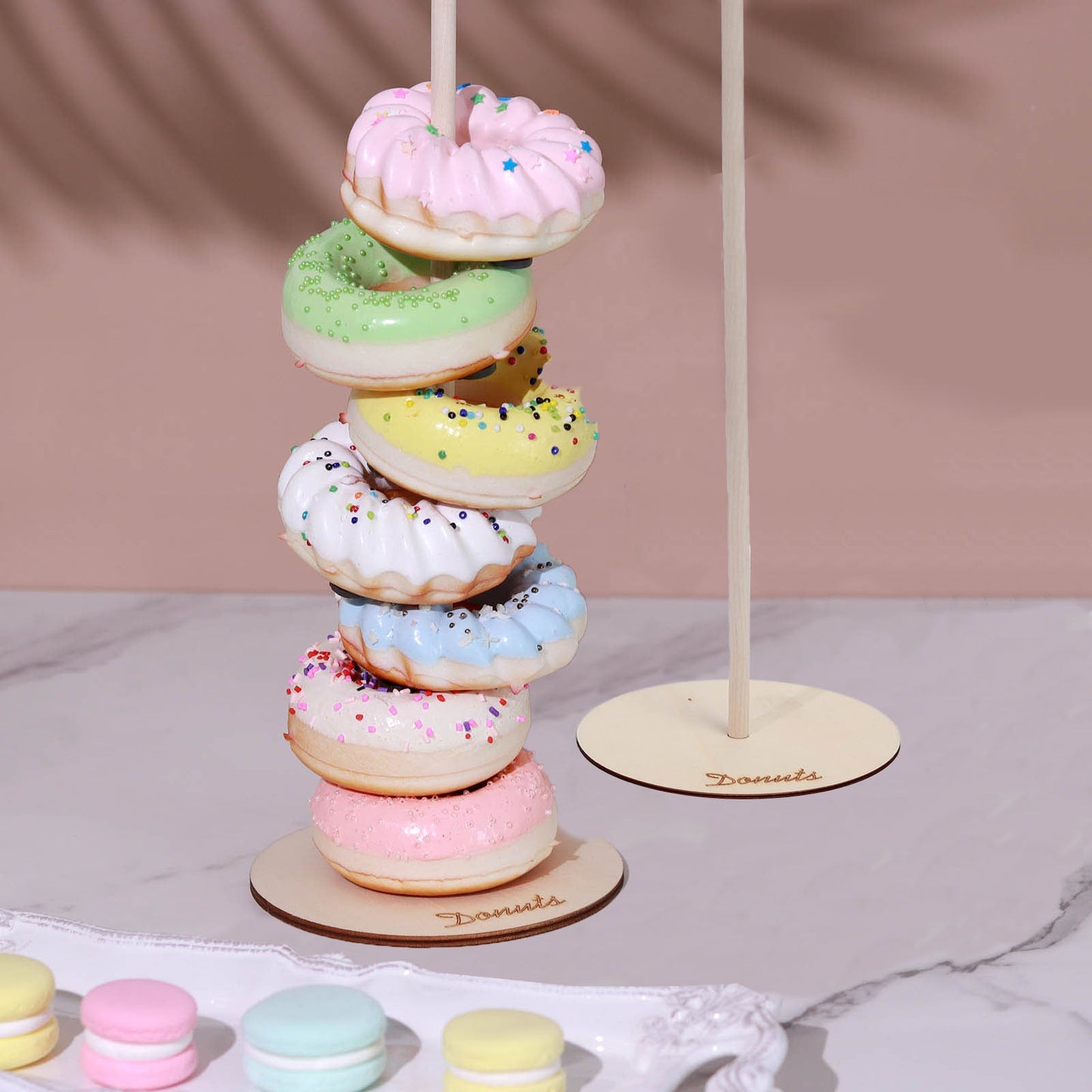 Colorful donut display stand for weddings and parties.