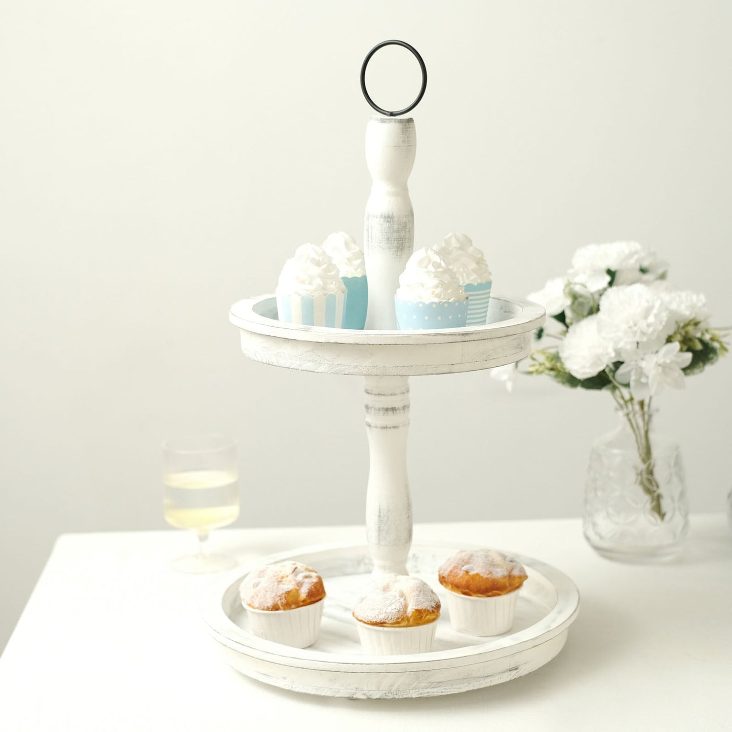 Rustic whitewashed 2-tier wooden serving tray stand with cupcakes.