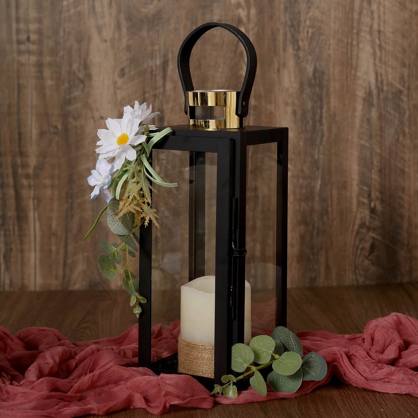 Black and gold stainless steel candle lantern centerpiece for outdoor decor.