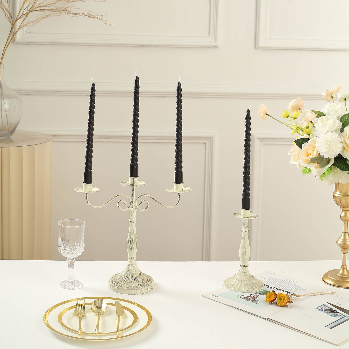 Black premium spiral taper candles in elegant candle holders.