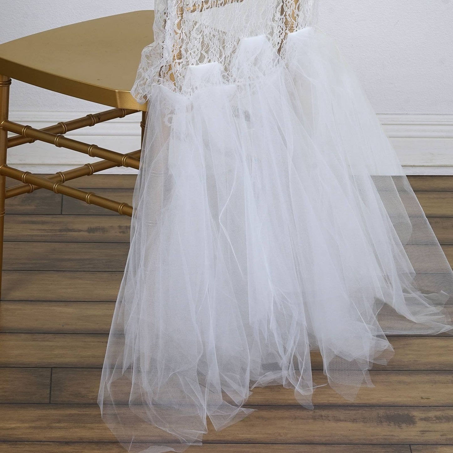 White lace and tulle chair tutu cover skirt for wedding decor.