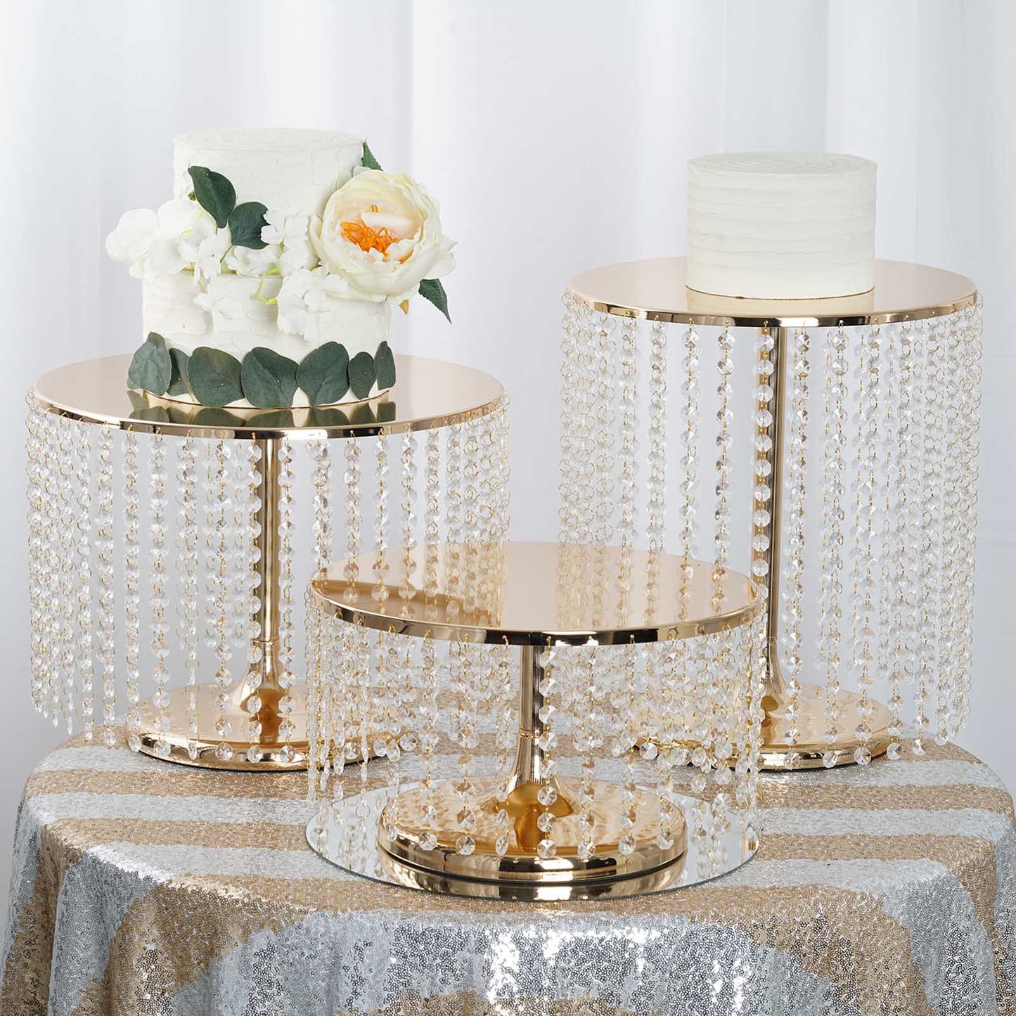 Metallic gold cake stand with crystal chains, perfect for desserts and cupcakes.