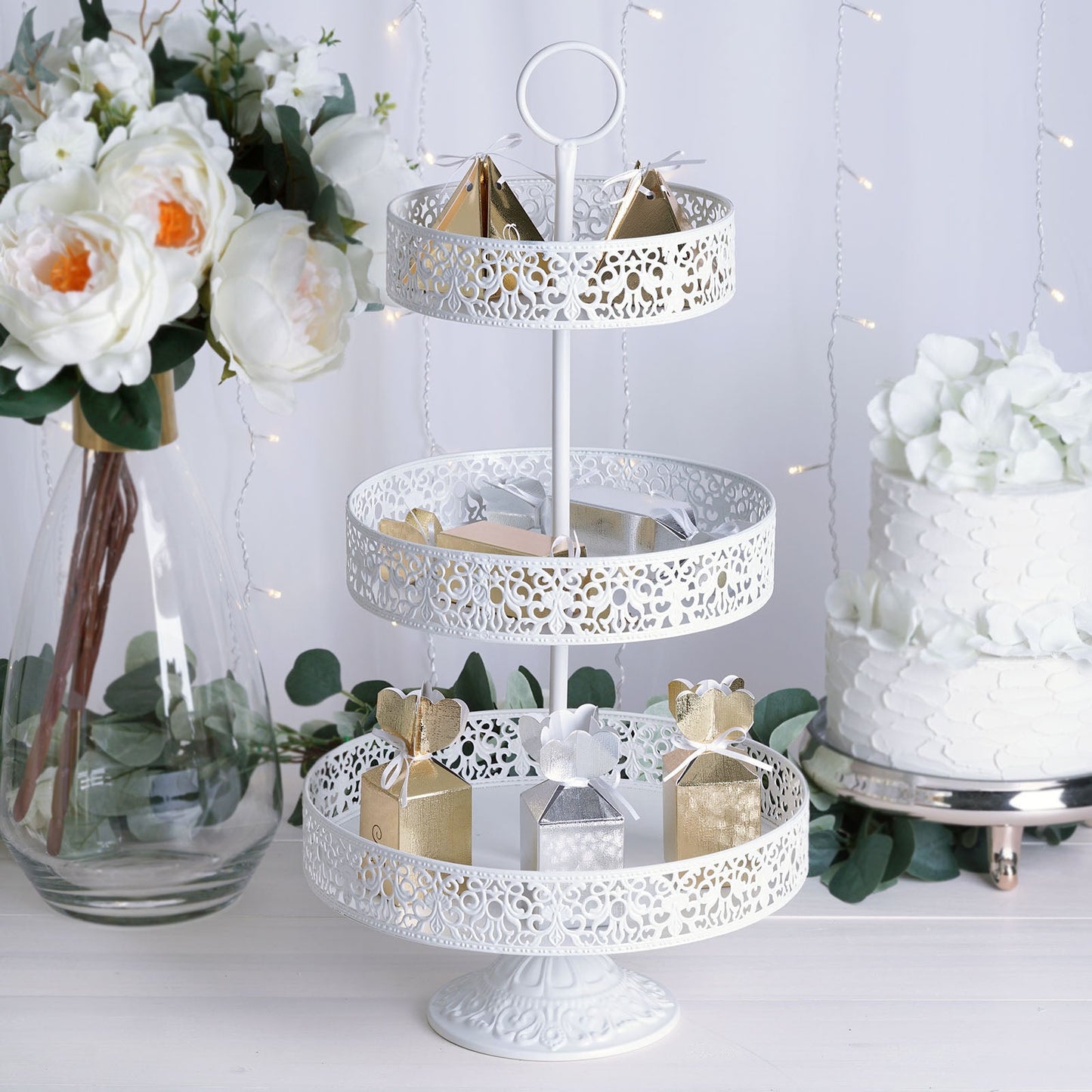 White 3-tier cupcake stand with decorative trays for desserts and treats.