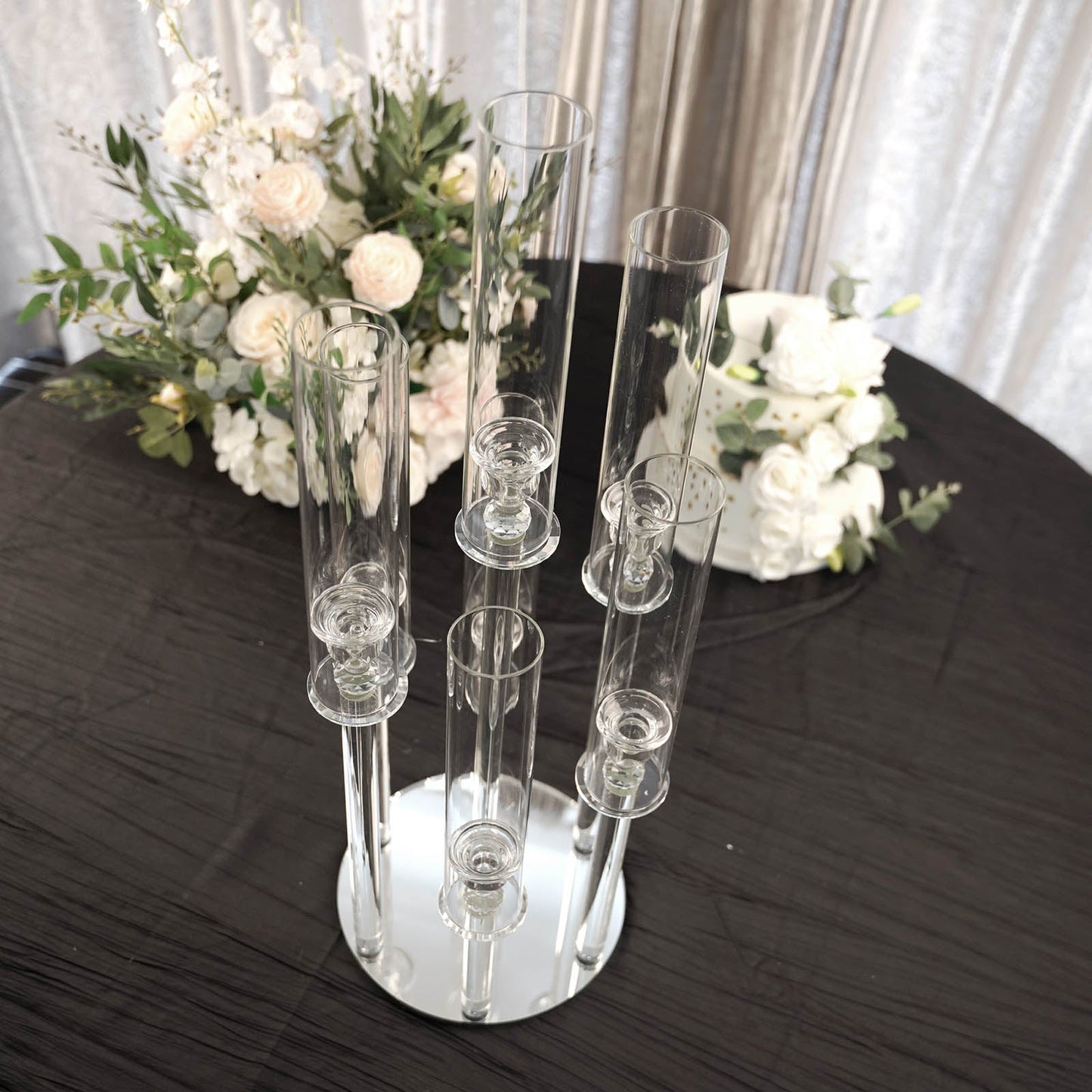 Clear 7 arm crystal candelabra candle holder on a mirror base.