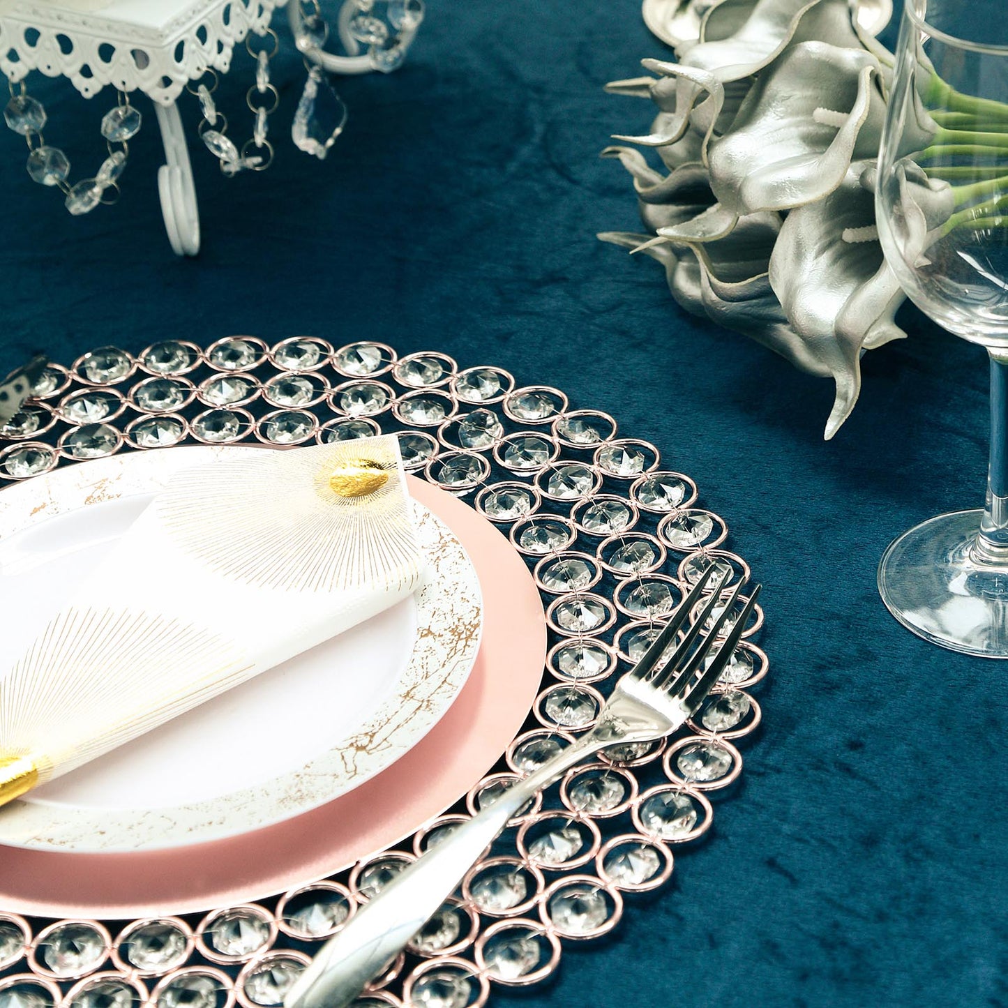 14" Rose Gold Charger Plate with Acrylic Crystal Beads on a teal table setting.