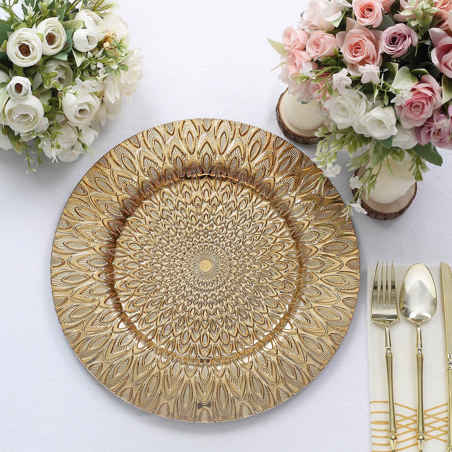 Gold embossed peacock design disposable charger plate on a table setting.