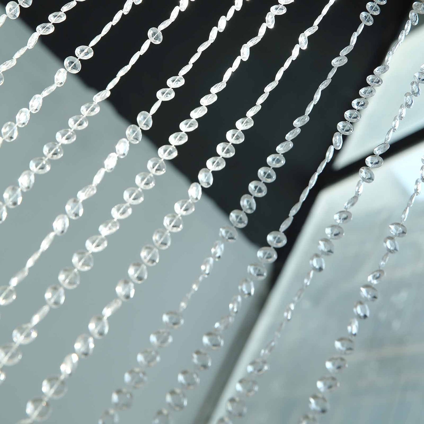 Clear crystal diamond beaded curtain with plastic rod and adjustable hooks.