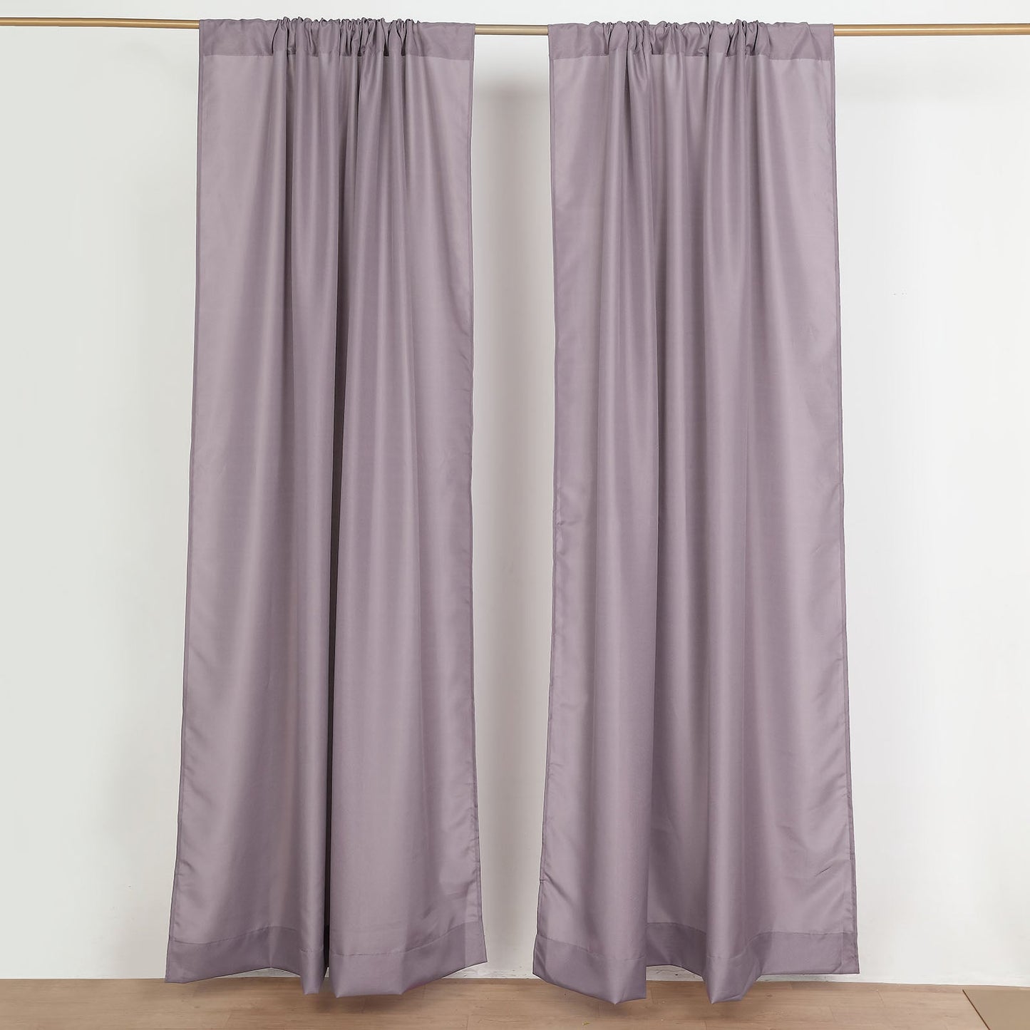 Violet amethyst polyester backdrop drape curtains with rod pockets.