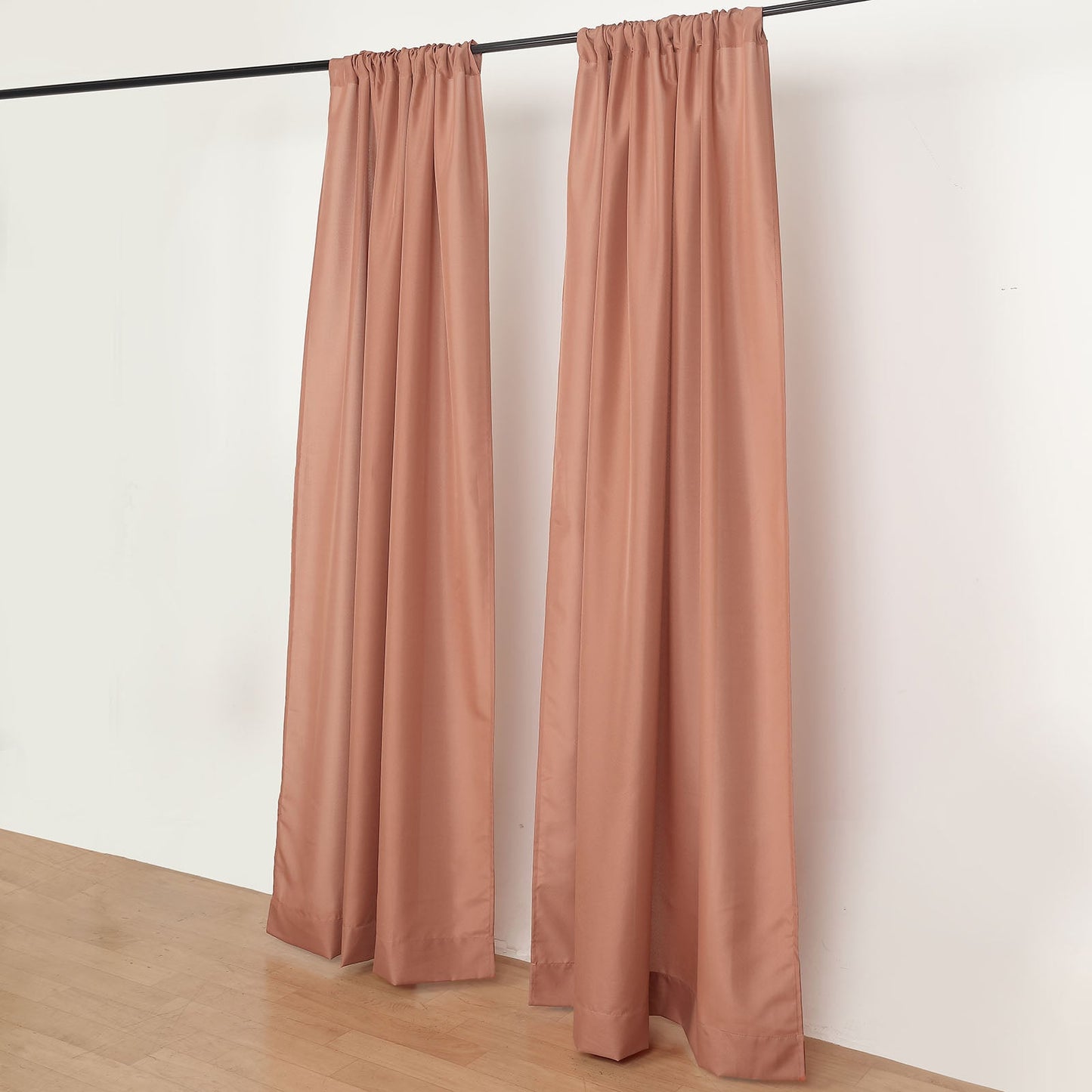 Terracotta drape curtains on a rod, perfect for events and dividers.