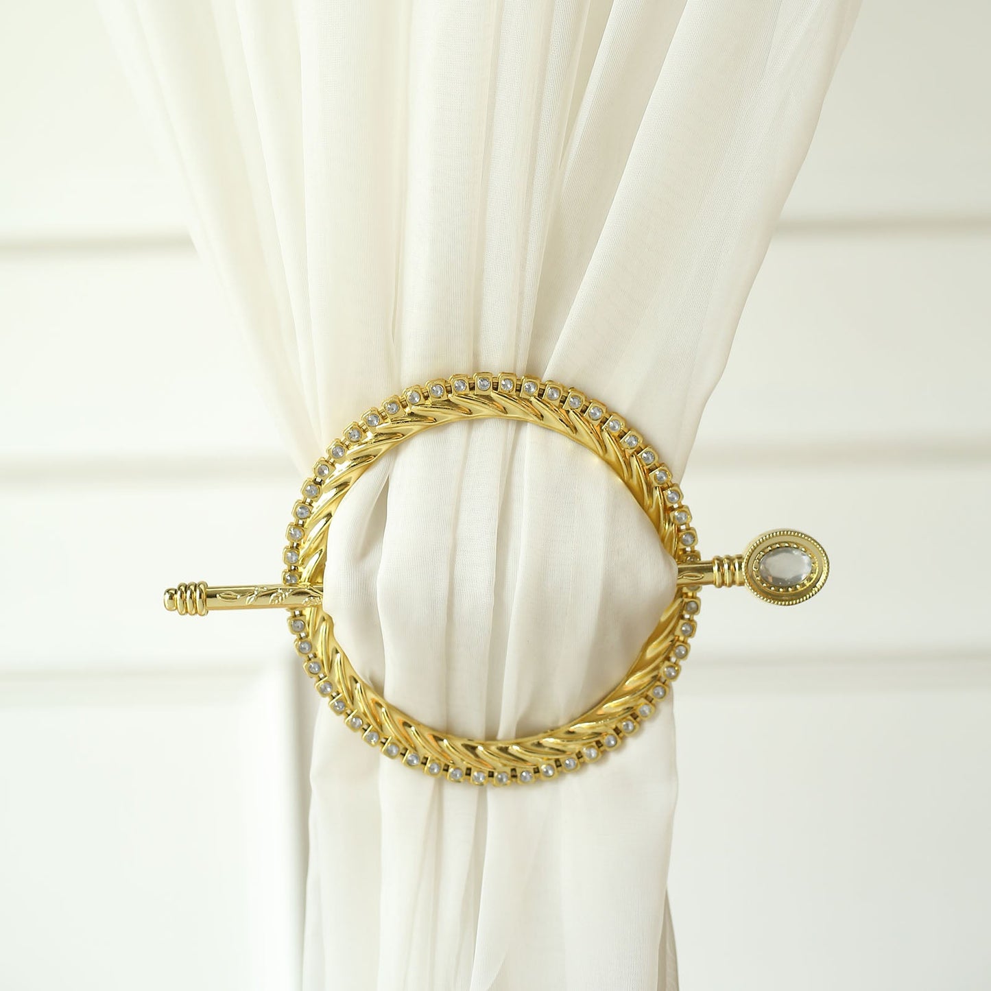 Gold braided curtain tie back with crystal diamond edge.