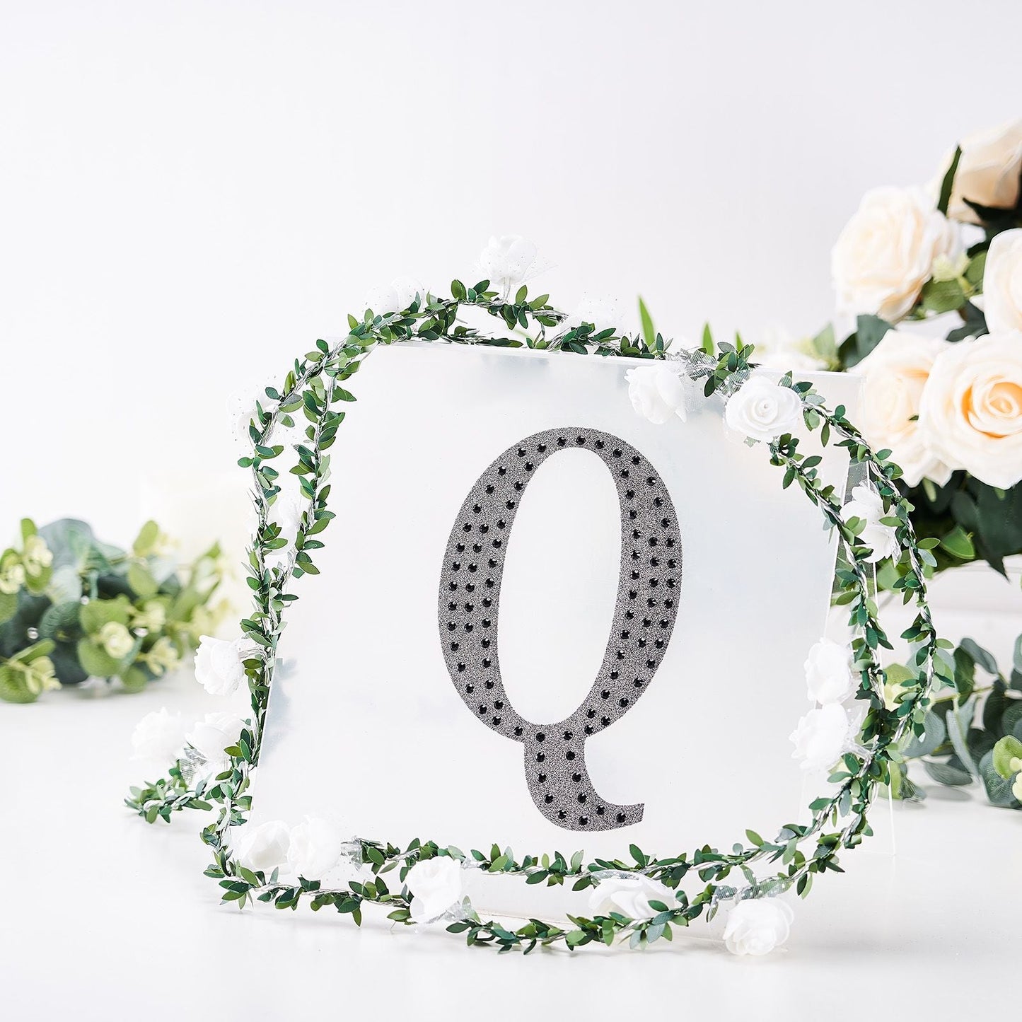 Black decorative rhinestone letter "Q" for DIY crafts.