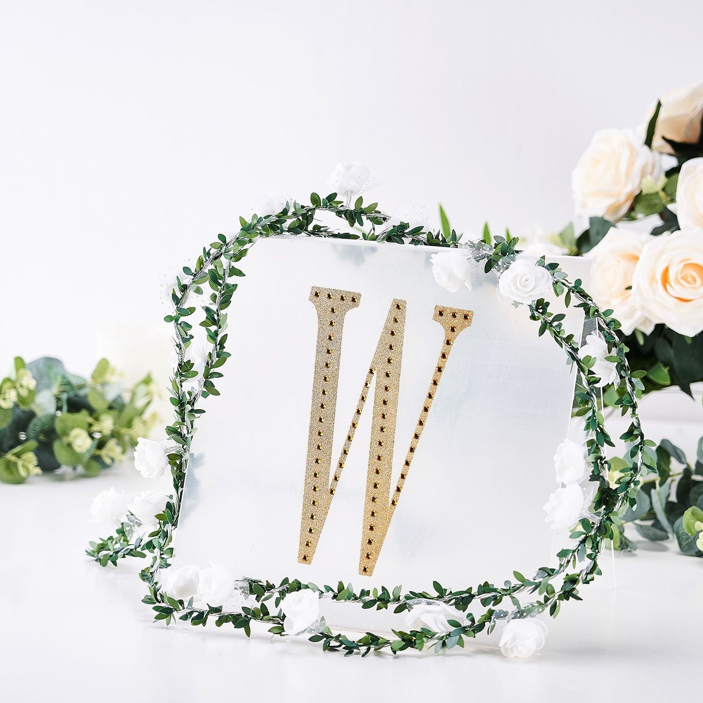 Gold decorative rhinestone letter sticker "W" with floral decor.