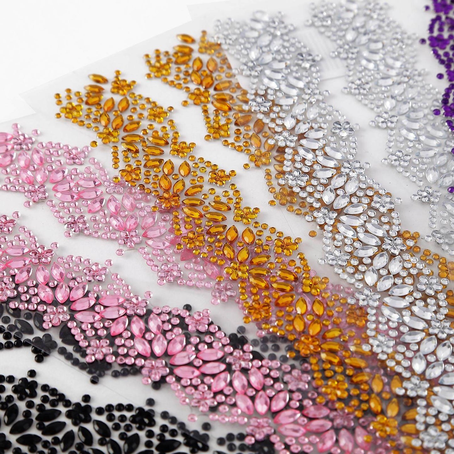 Gold floral trim rhinestone stickers in a variety of colors.