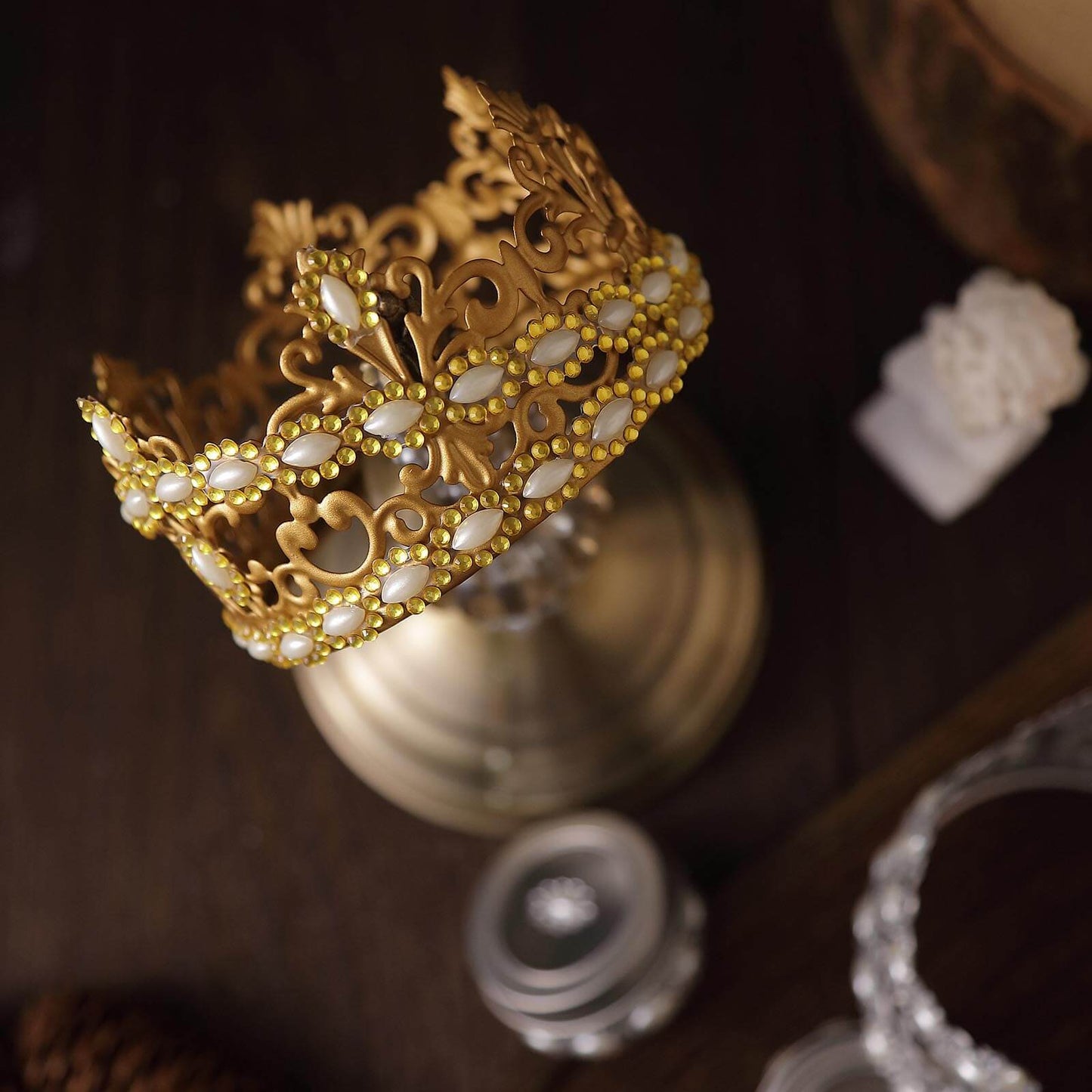 Gold stick-on oval rhinestone gems for embellishing crafts.