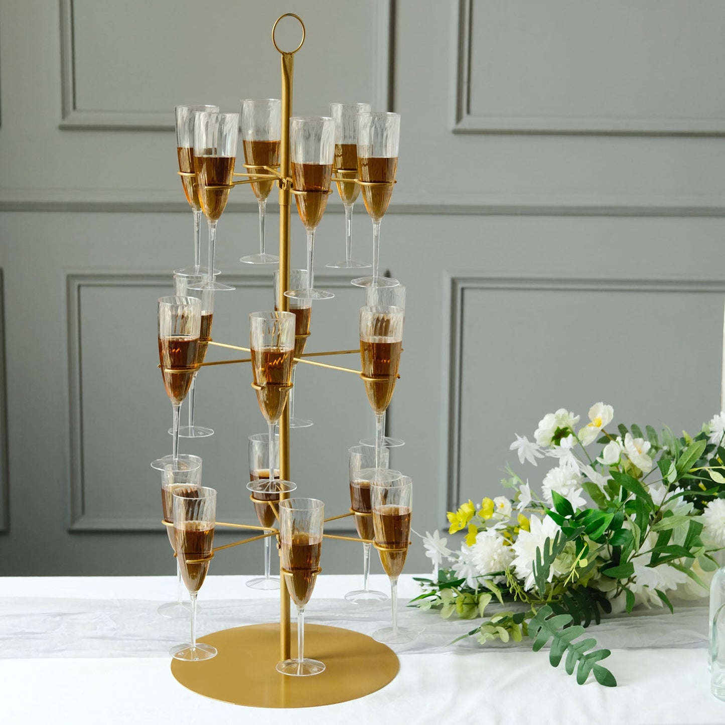 Gold metal 3-tier wine glass stand with 18 champagne flute holders.