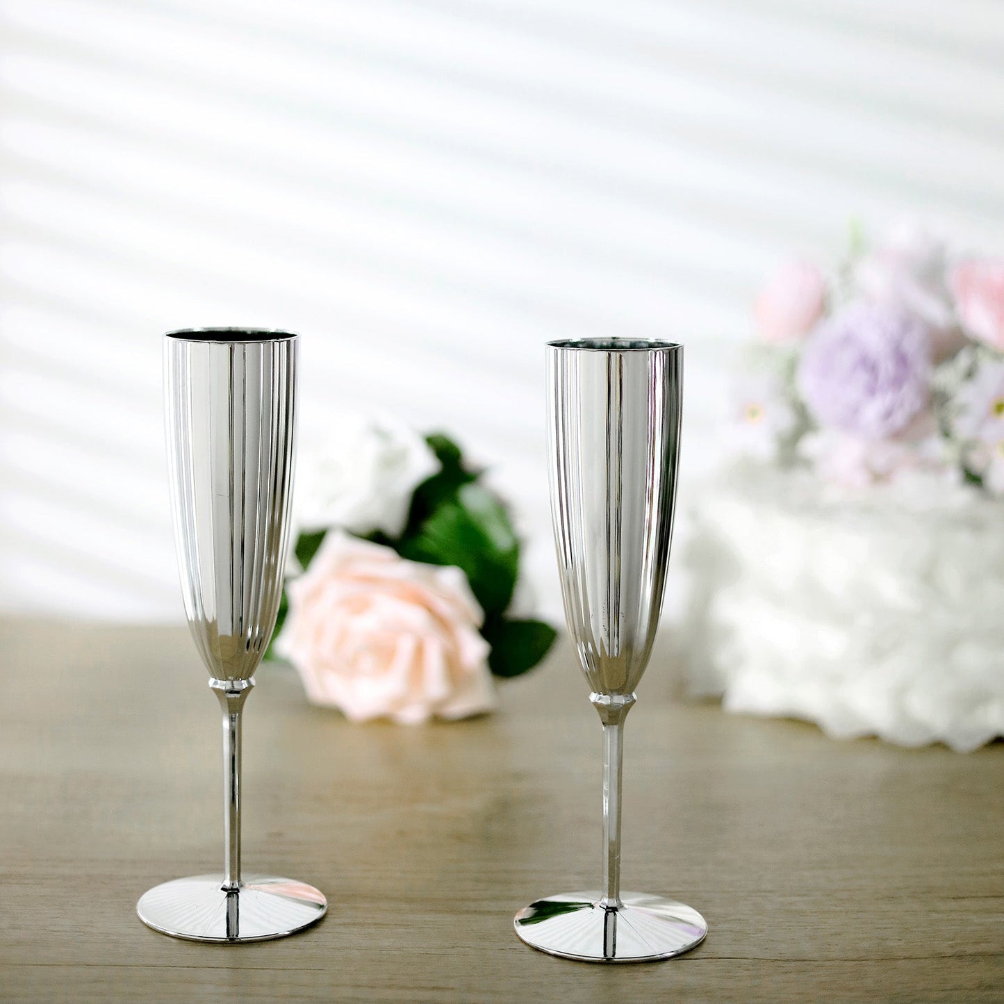 Silver disposable champagne flutes for celebrations, set of 6.