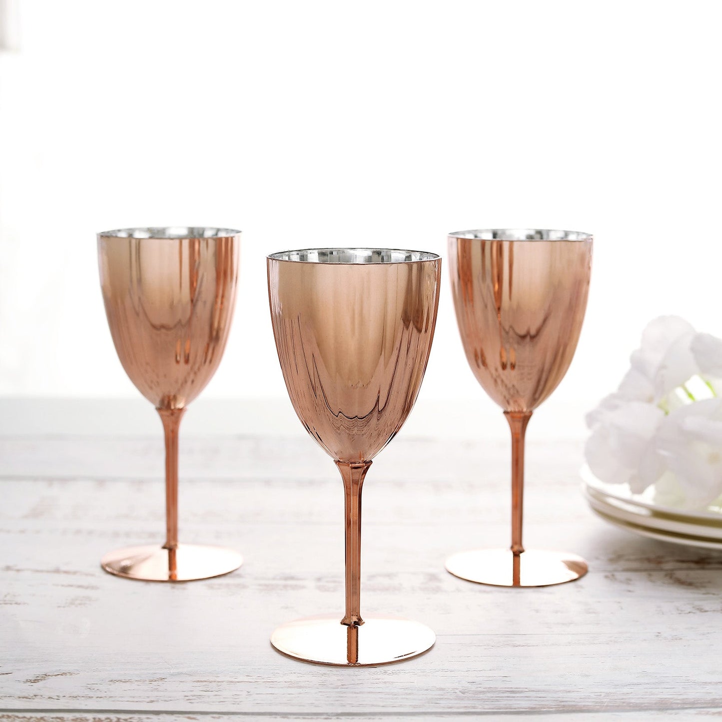 Rose gold disposable wine glasses, perfect for parties or events.