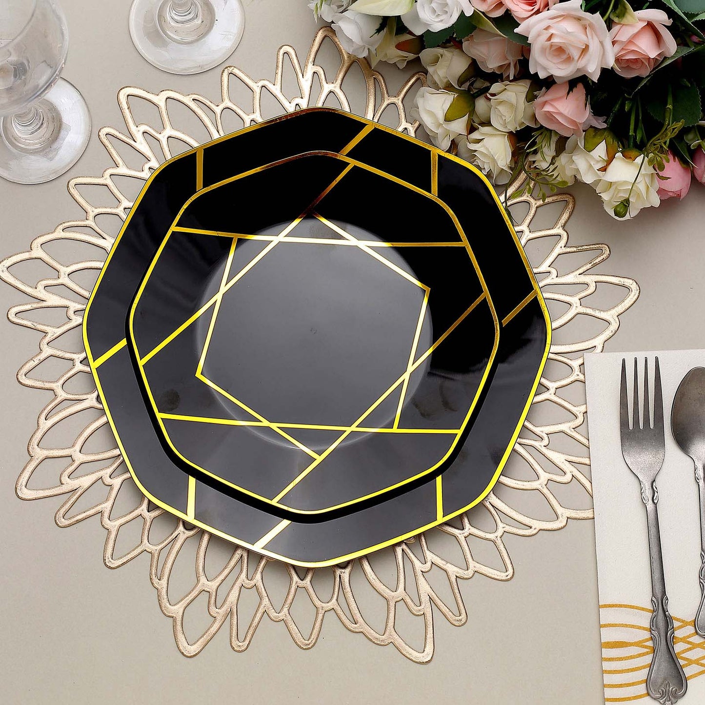 8" black and gold geometric design disposable dessert plate on a decorative table setting.