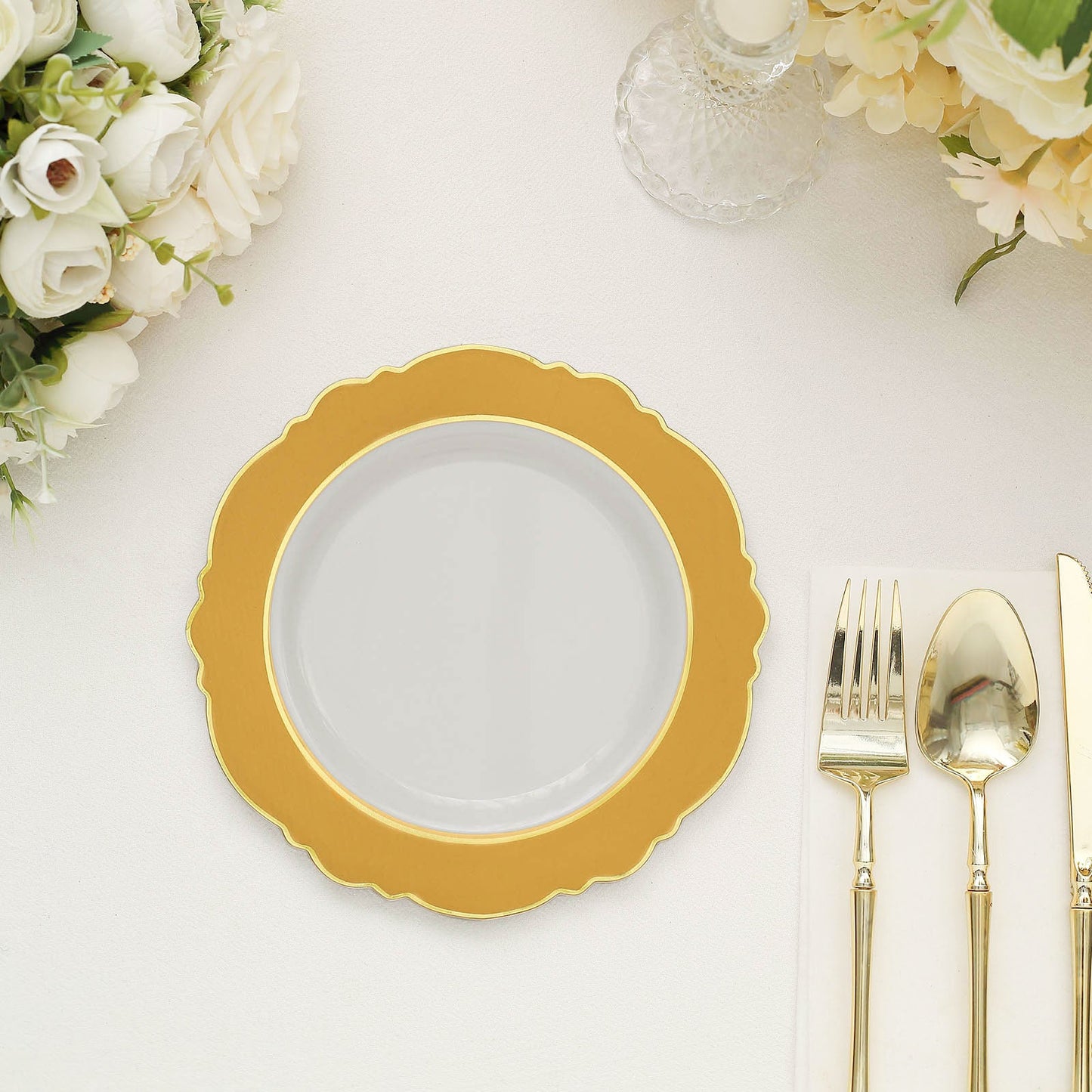 Gold and white disposable salad appetizer plate with round blossom design.