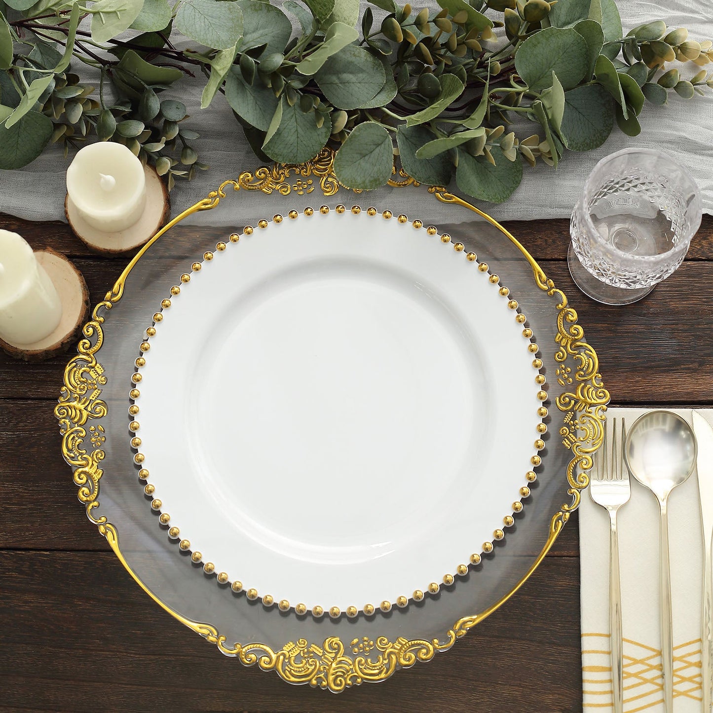 White disposable dinner plate with gold beaded rim for festive occasions.