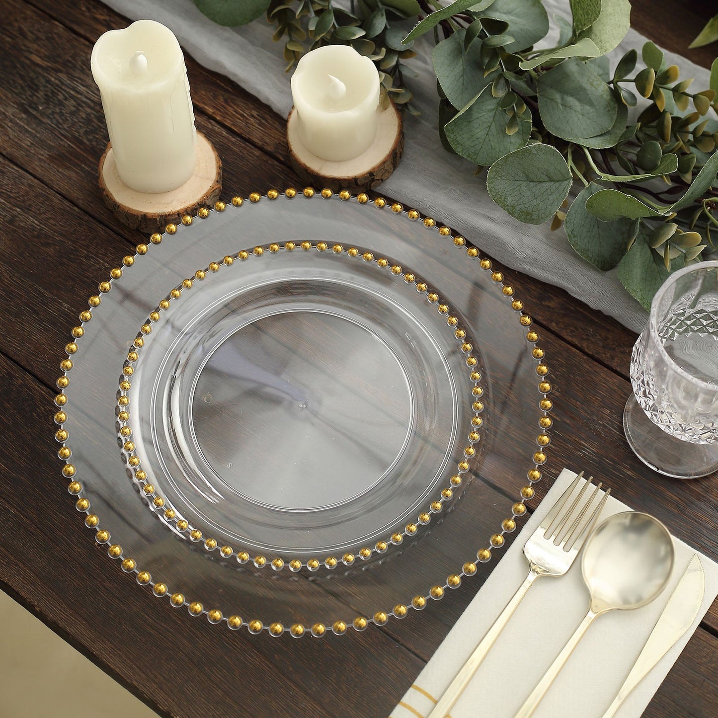 Clear plastic dessert plate with gold beaded rim, perfect for parties and events.
