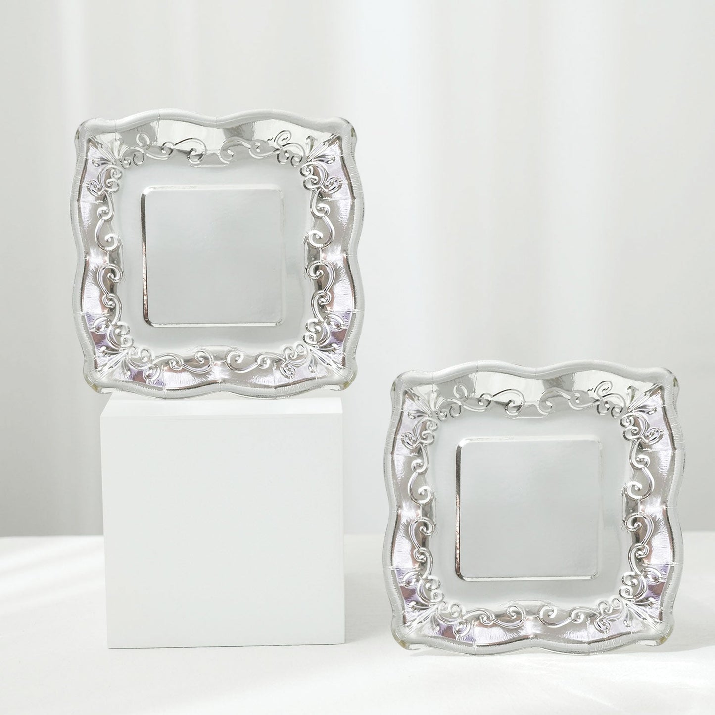 Silver vintage 7" square appetizer plates with embossed scroll design.