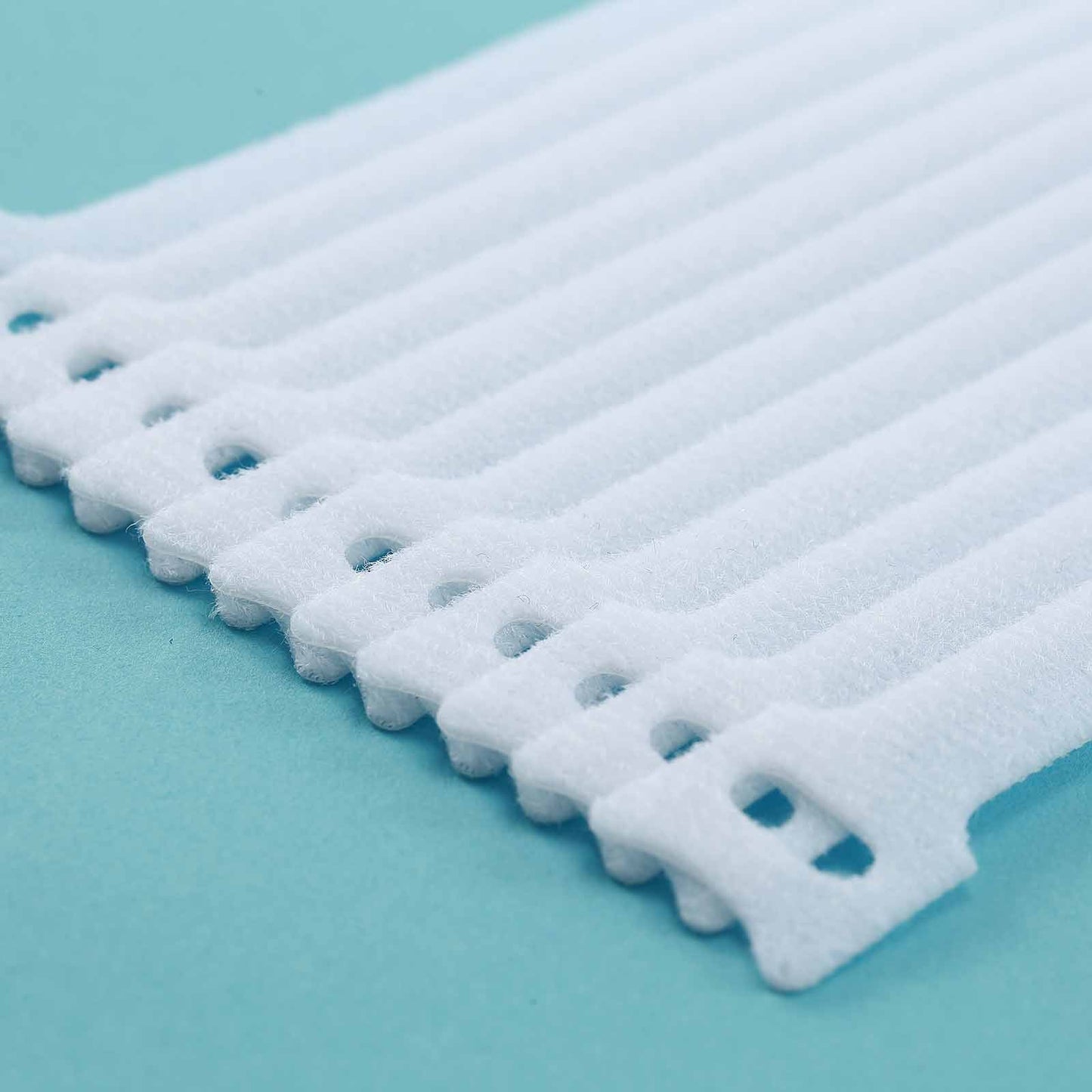 White reusable Velcro cable ties for cord organization.