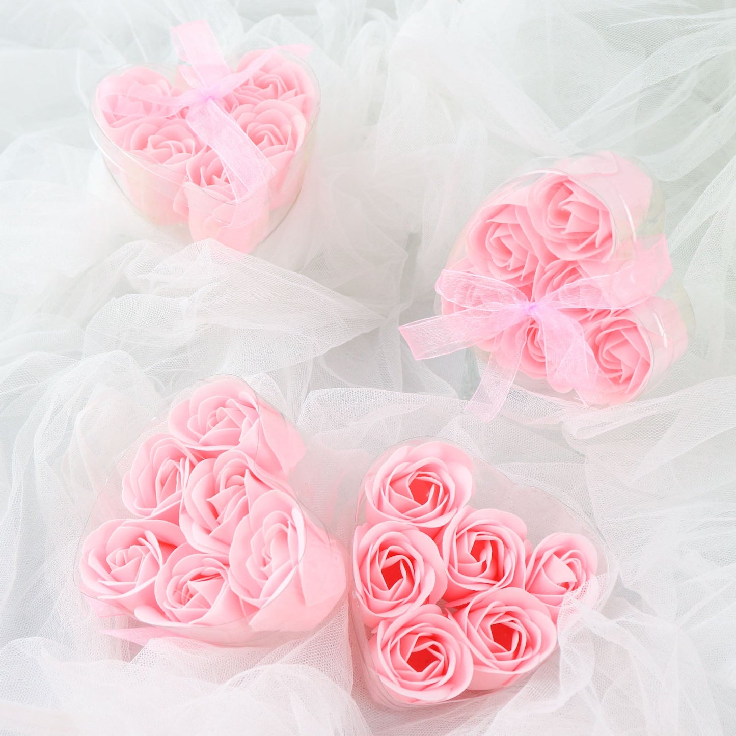 Blush pink rose soap heart party favors in gift boxes with ribbon.