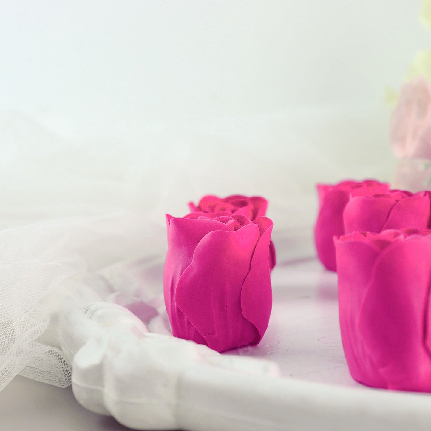 Fuchsia scented rose soap hearts in gift boxes with ribbon.