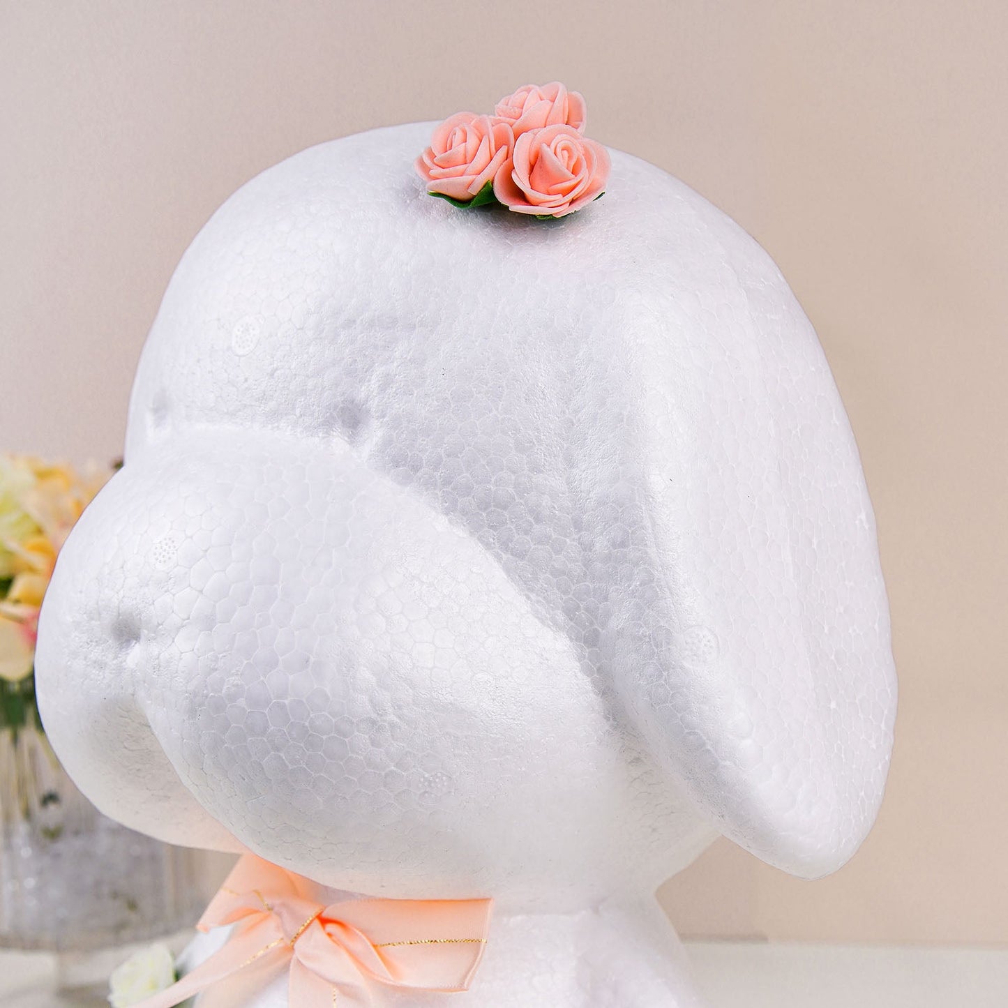 White 3D StyroFoam puppy with flowers on its head