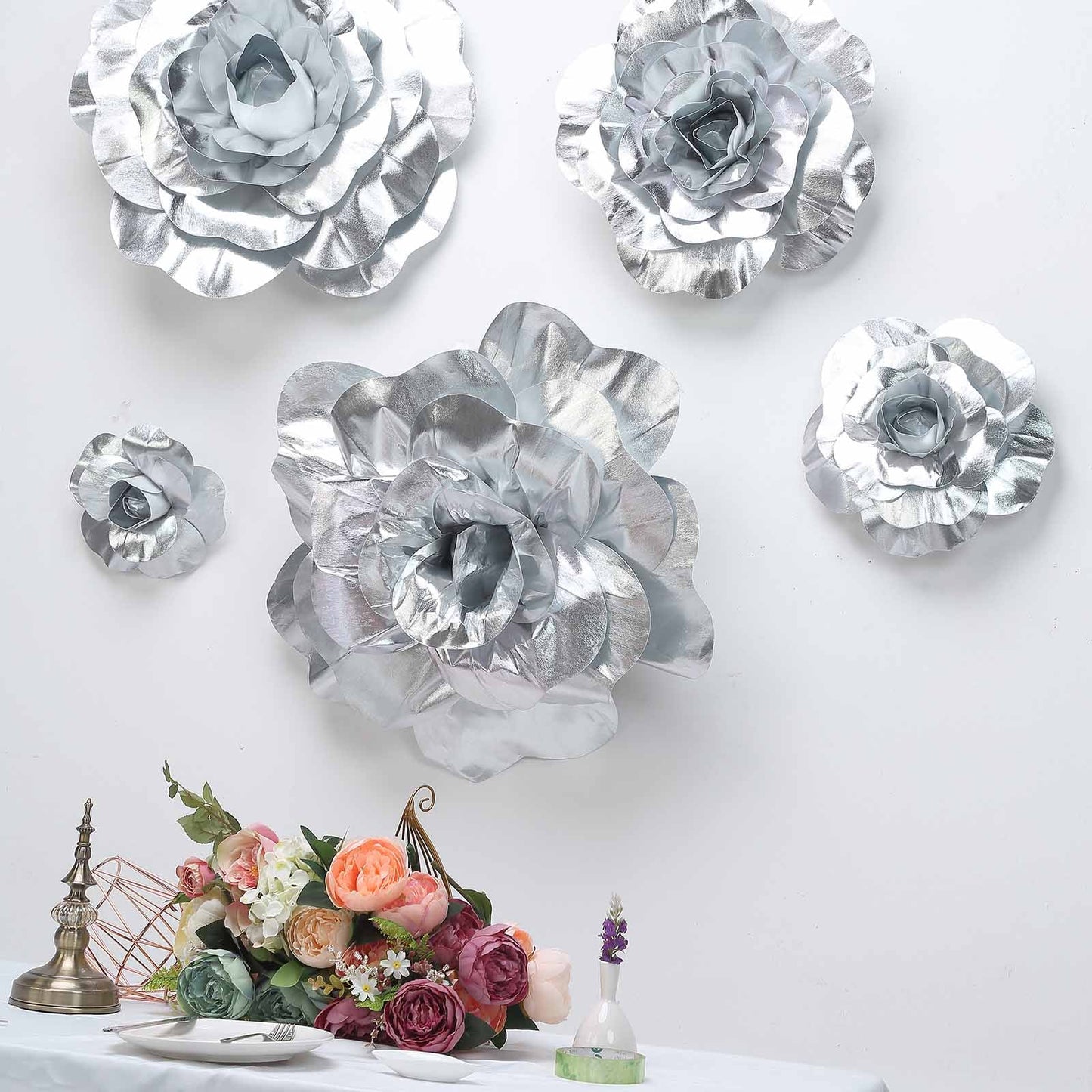 Large silver real touch artificial foam DIY craft roses in a decorative arrangement.