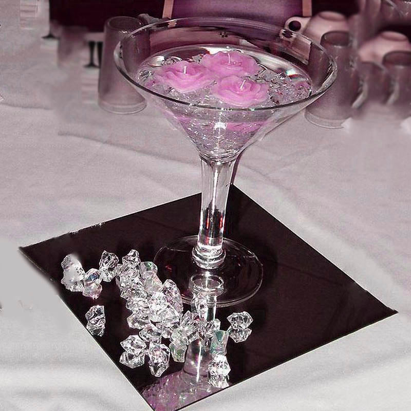 Pink acrylic ice bead vase fillers in a glass bowl with pink roses.