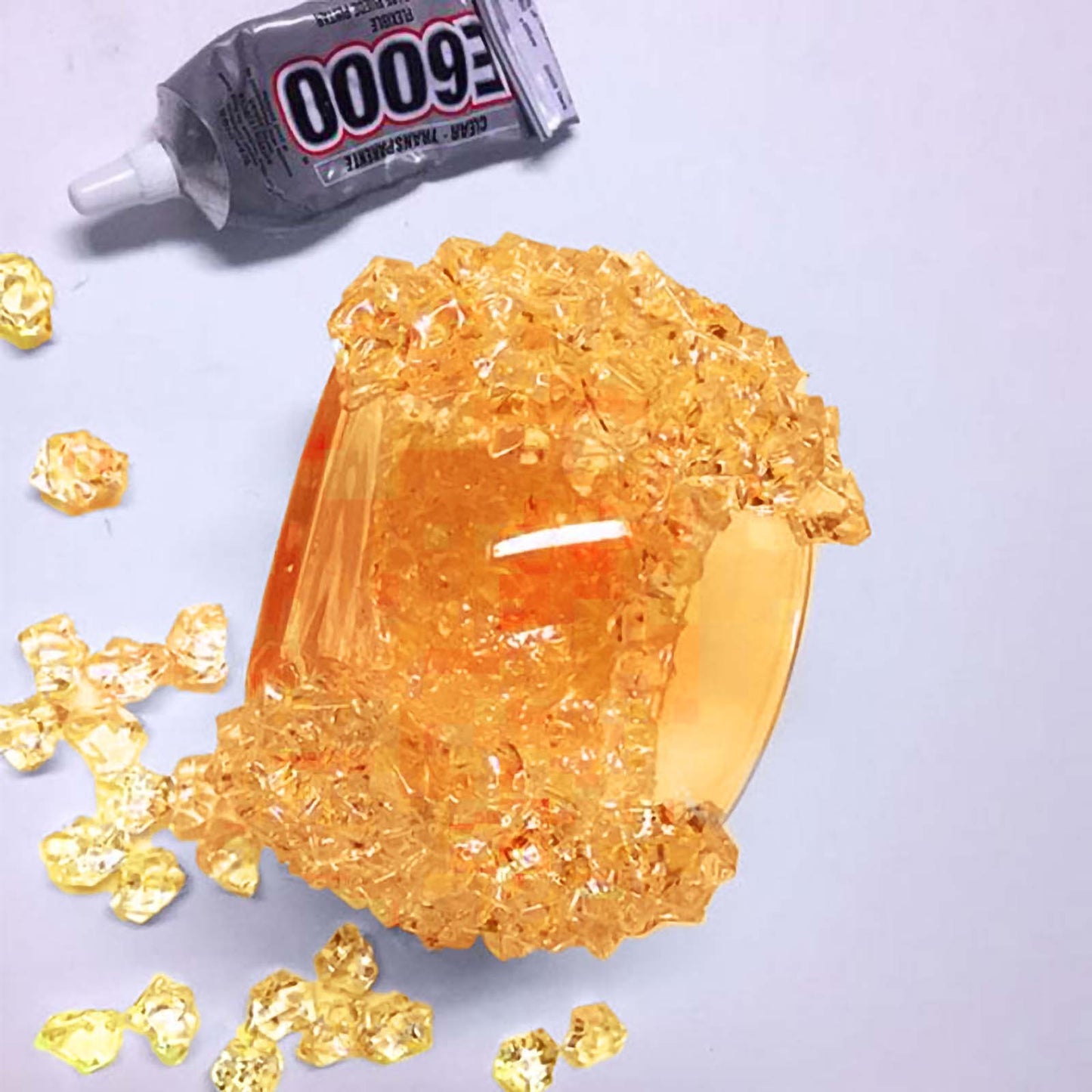 Orange acrylic ice bead vase fillers for DIY crafts.