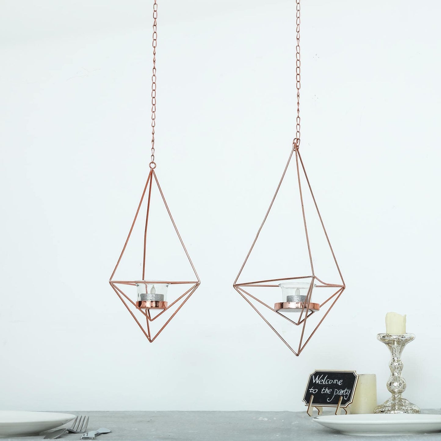 Rose gold hanging diamond tealight candle holders in geometric flower design.