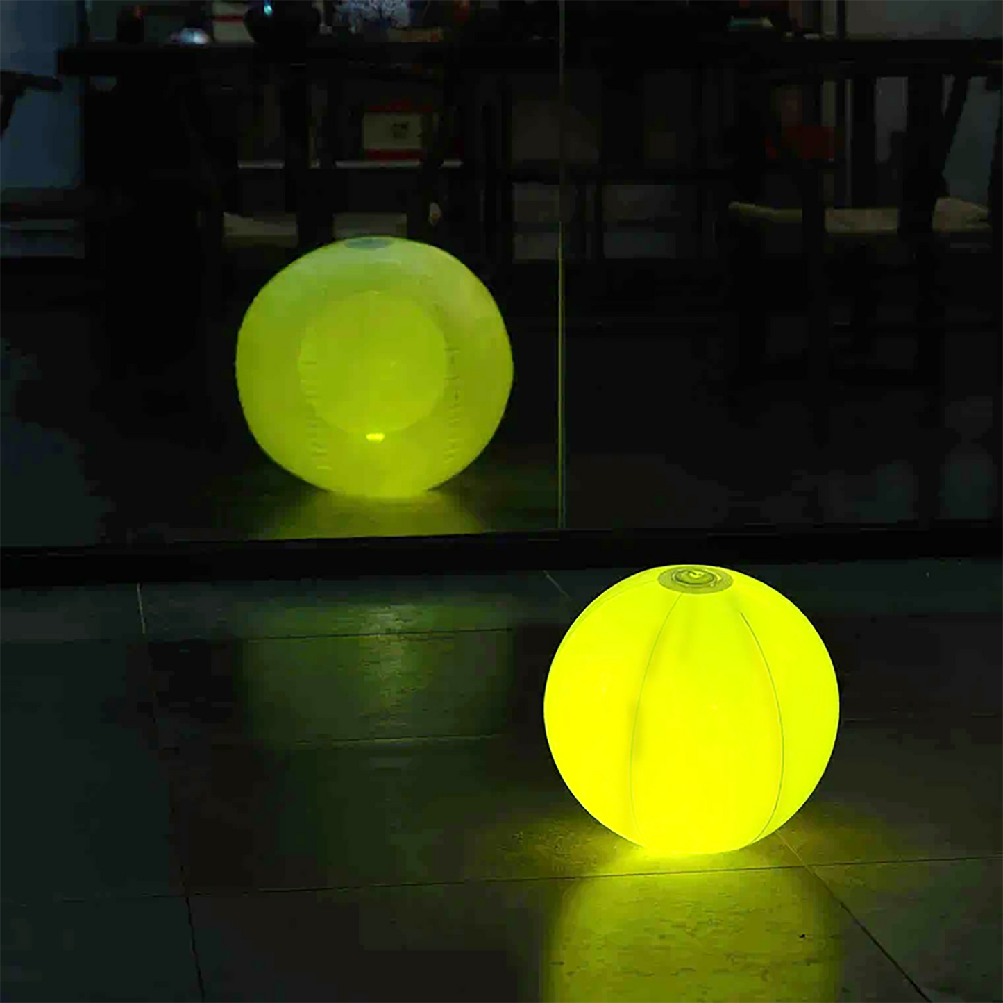 20" Inflatable Garden Light Up Ball in bright yellow, perfect for outdoor decor.