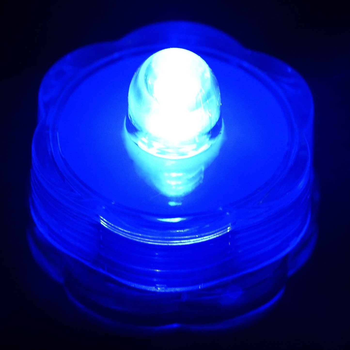 Light blue flower-shaped waterproof LED light, battery operated and submersible.