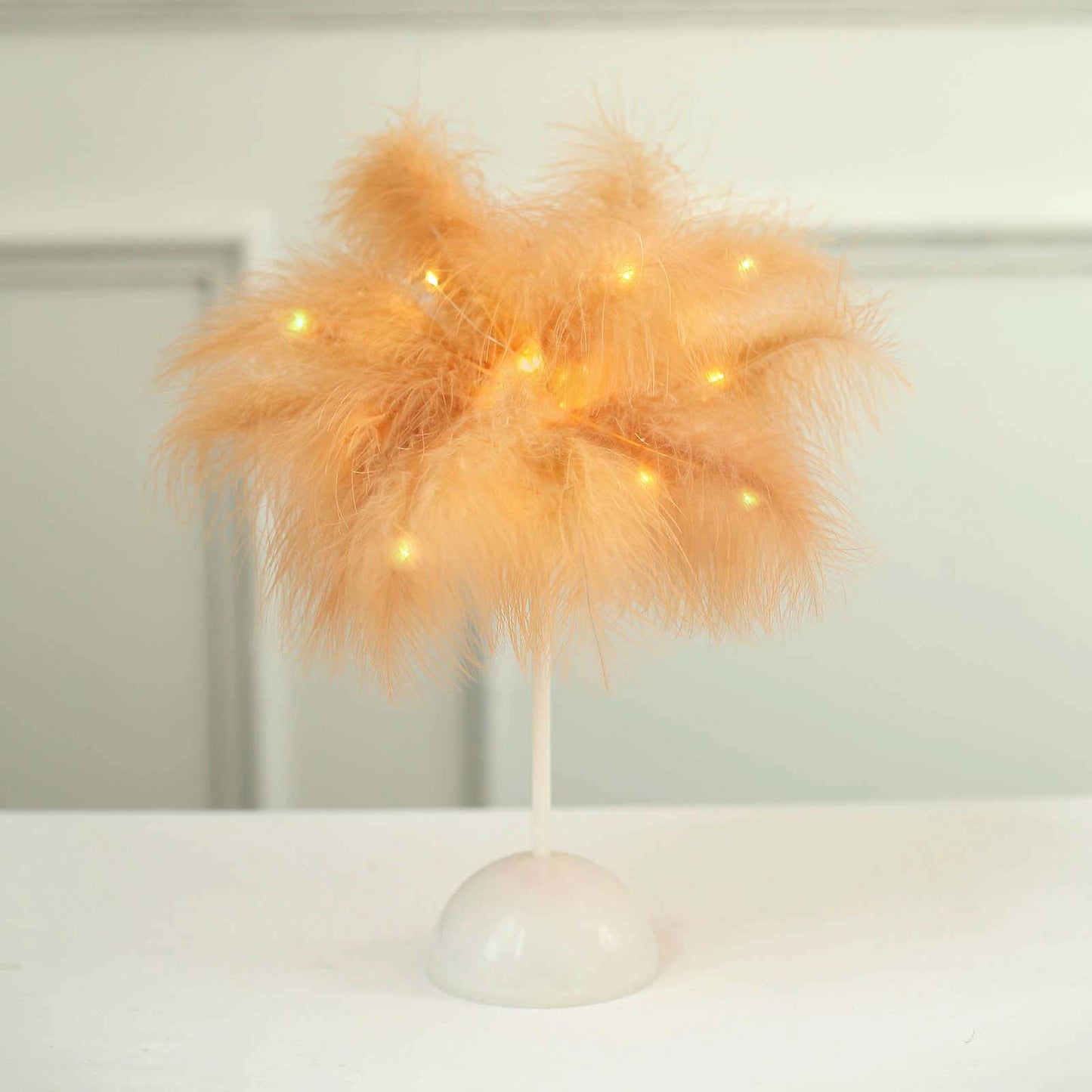 Peach LED natural feather table lamp for wedding centerpiece.
