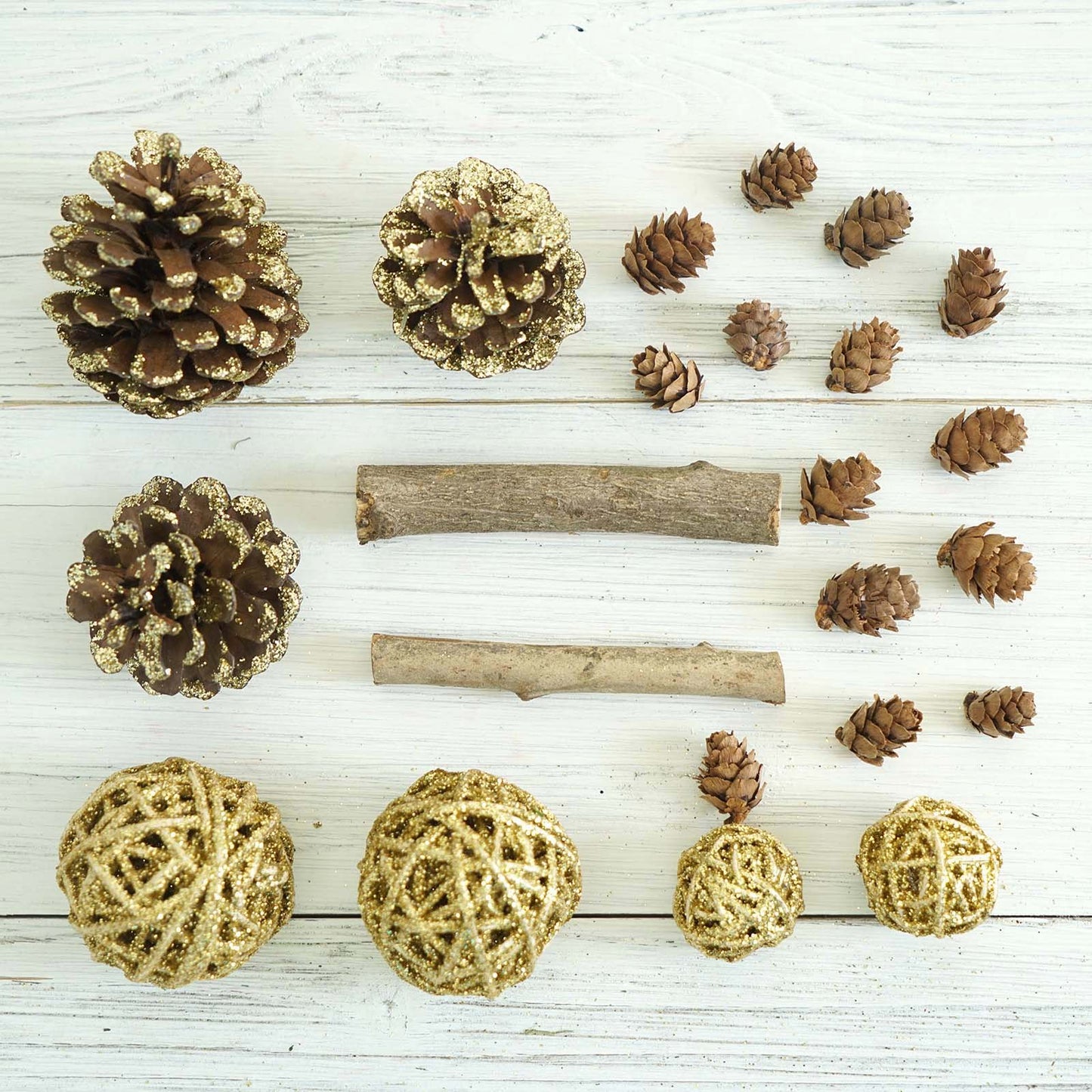 Natural dried assorted potpourri bowl fillers in gold and brown.