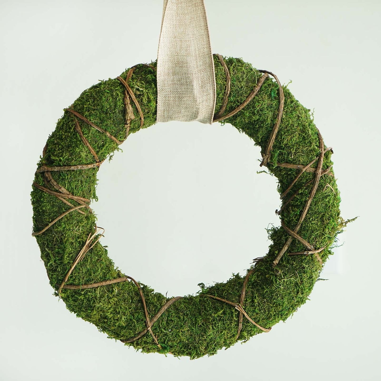 14" green preserved moss wreath with twine wrap.