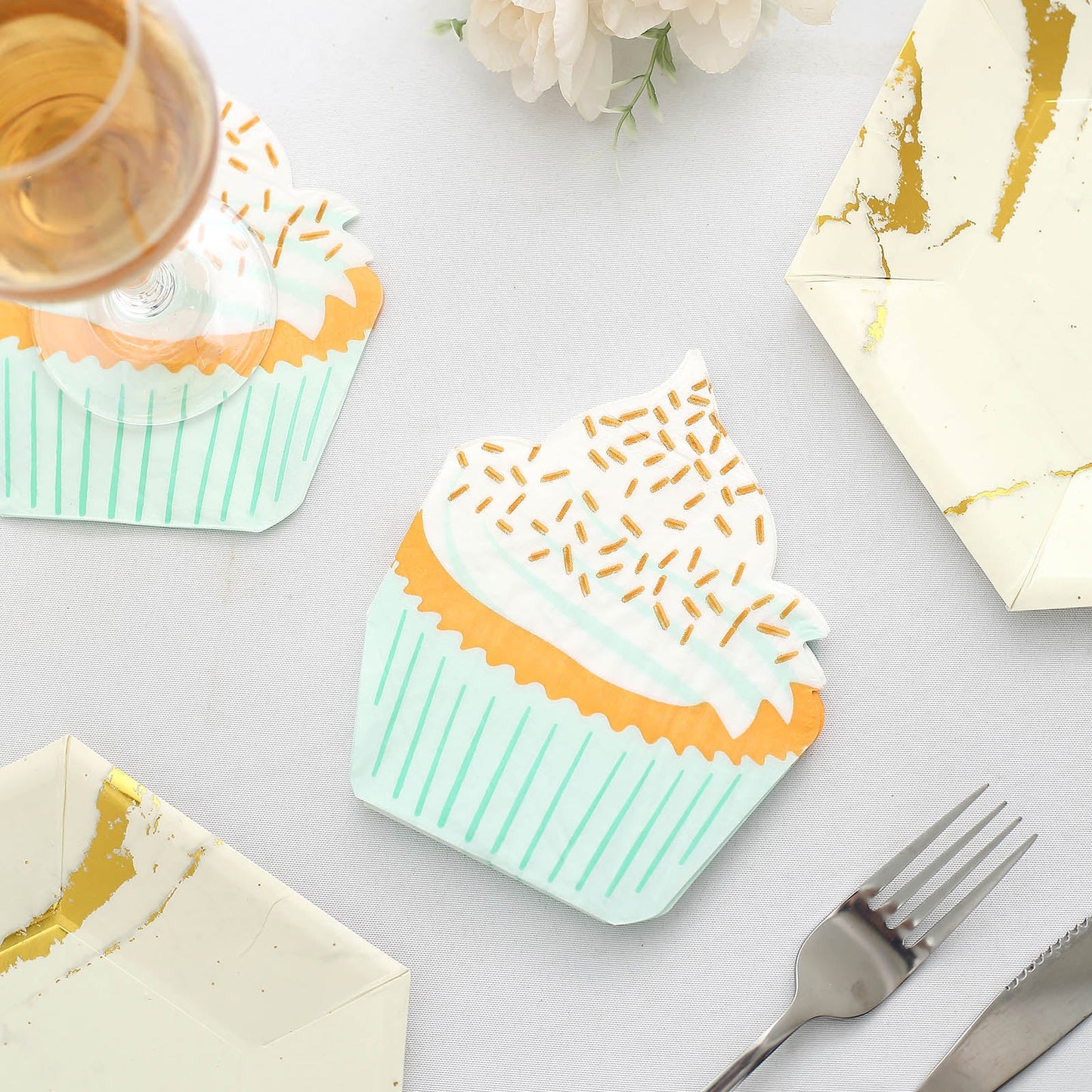 Cupcake-themed disposable napkins in mint green and orange.